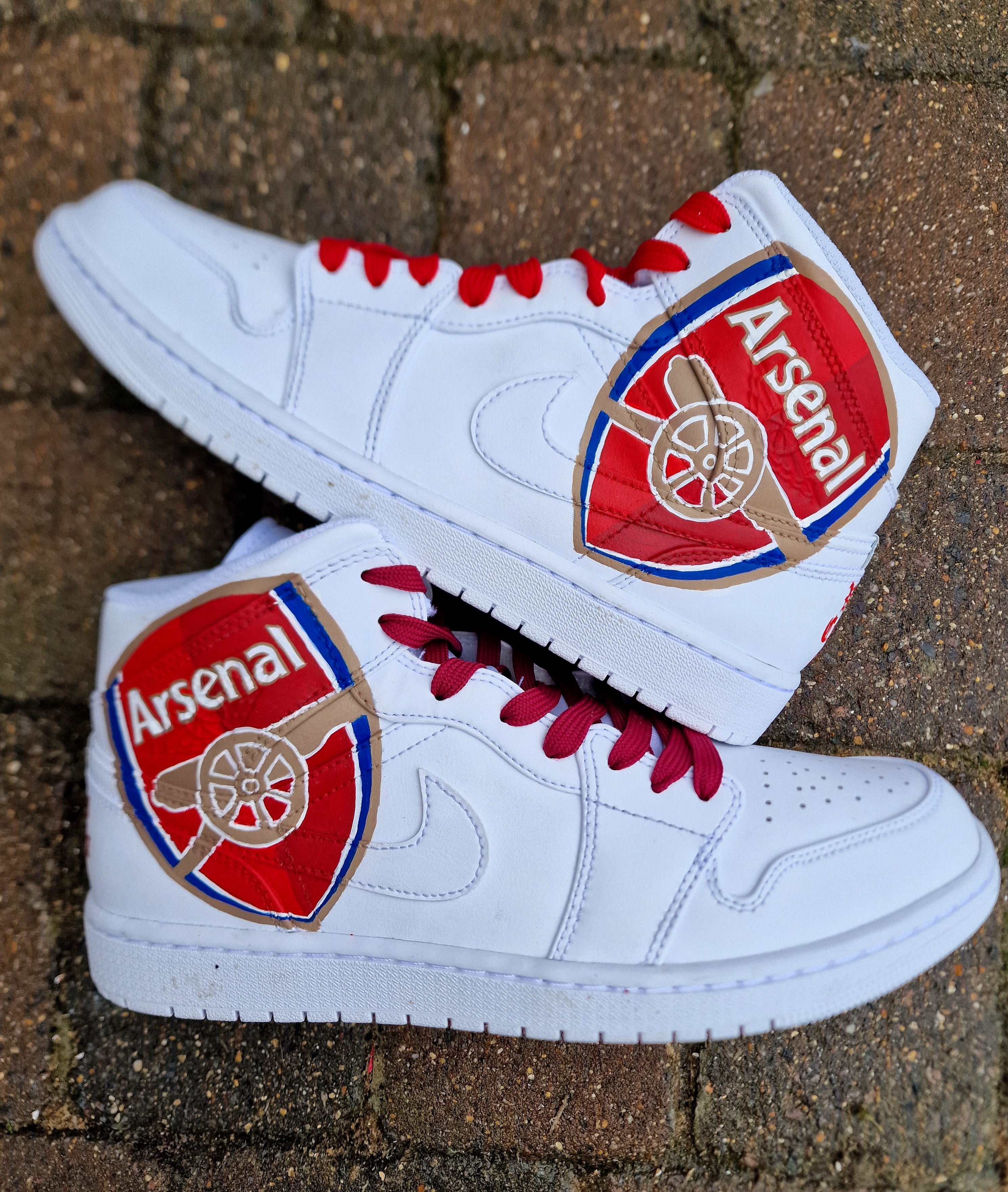 Custom Arsenal logo and 'Victoria Concordia Crescit' motto on Nike Jordan 1s