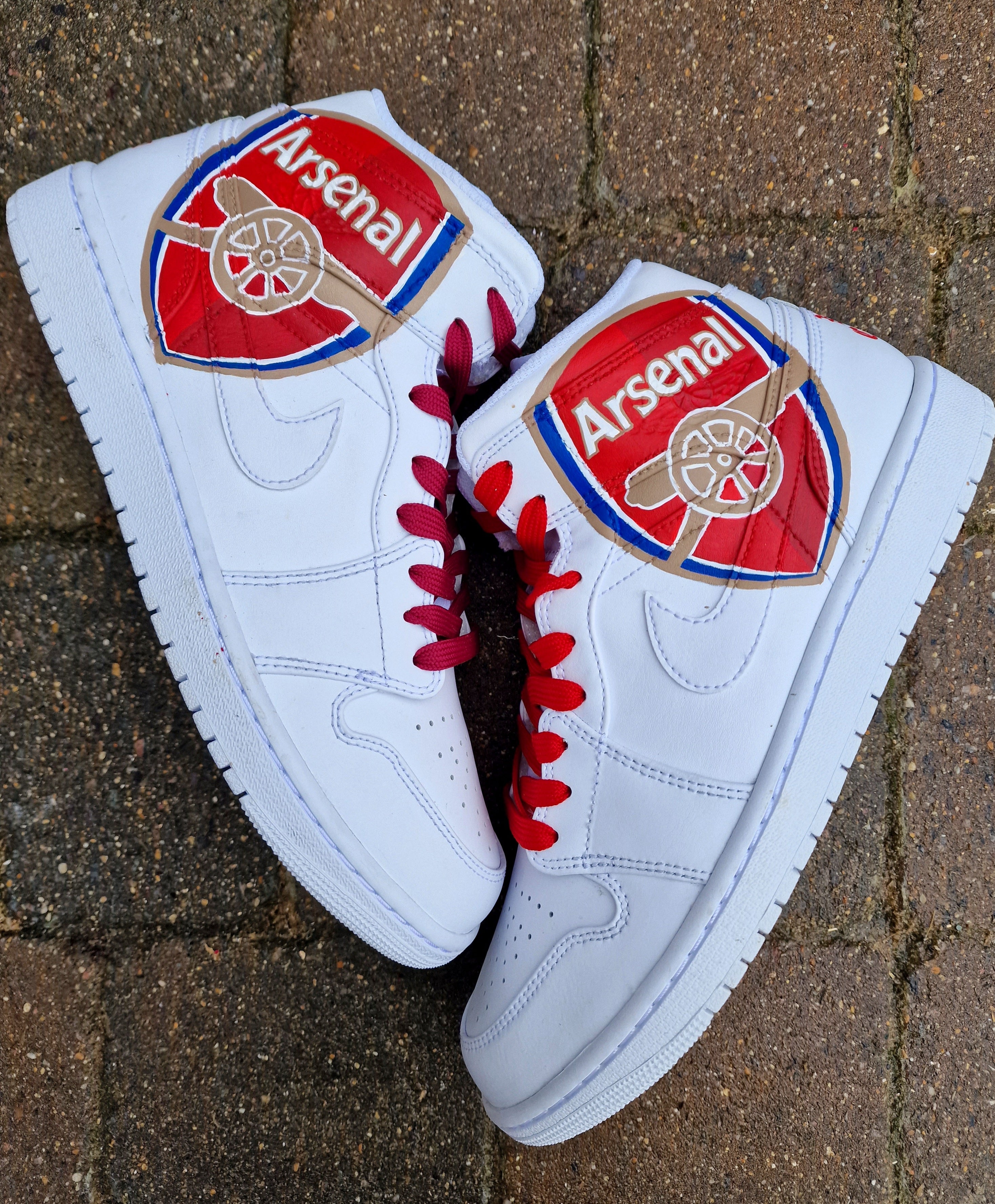 Hand-painted Nike Jordan 1s featuring Arsenal logo and 'Victoria Concordia Crescit'