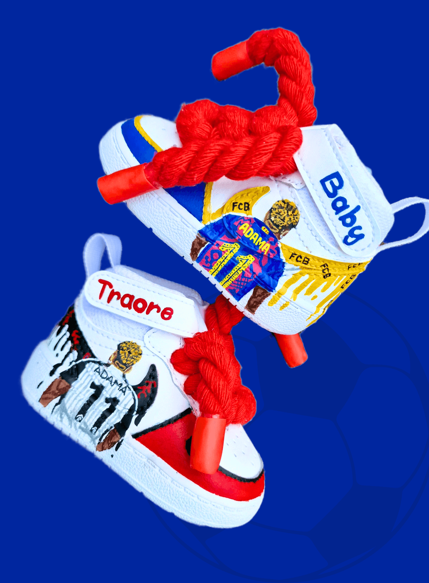 Custom hand-painted baby sneakers inspired by footballer Adama Traoré, featuring FC Barcelona and Fulham FC themes, complete with team logos, jersey illustrations, red braided laces, and personalized strap names on a white baby shoe base.