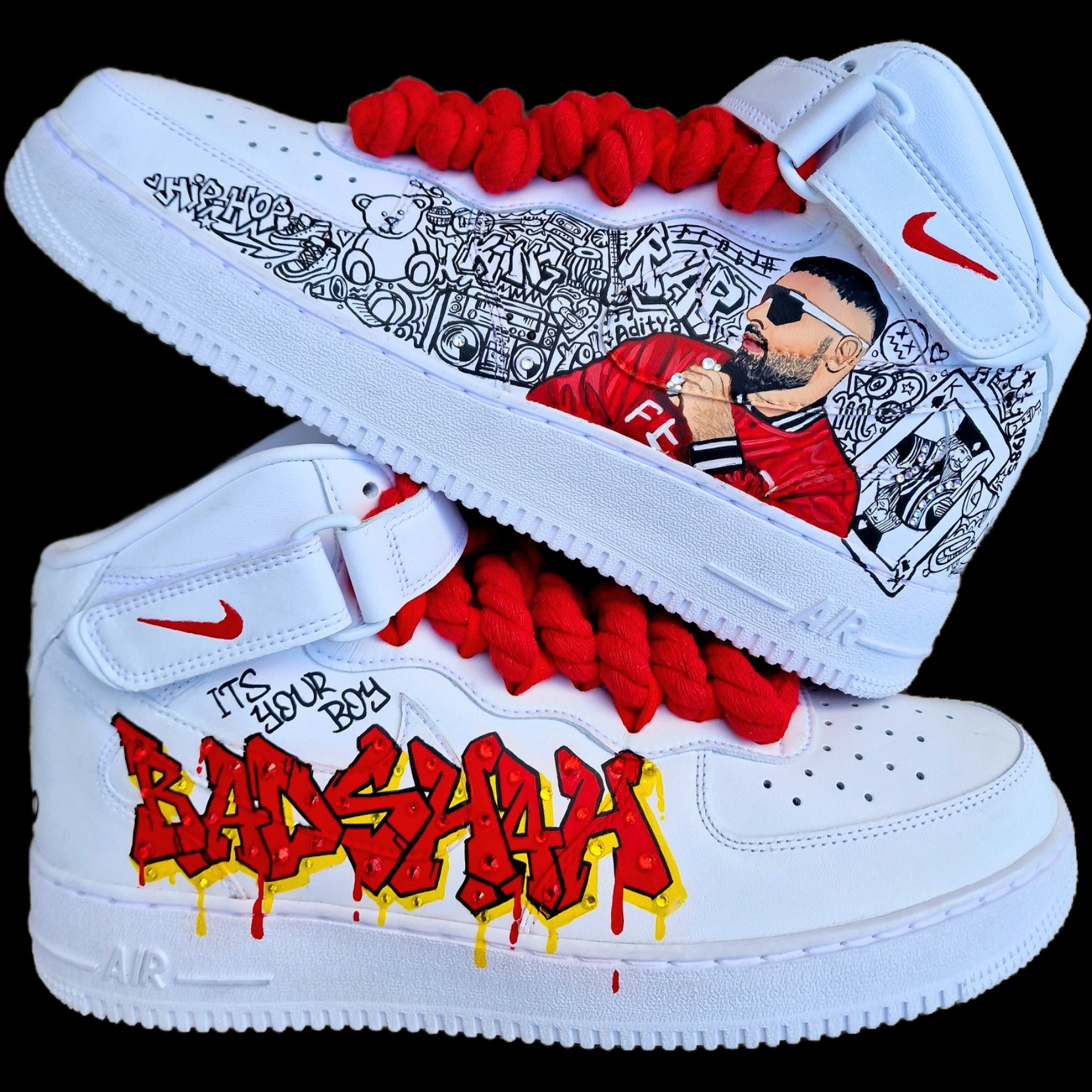 Custom white Nike Air Force 1 sneakers hand-painted with Badshah rapper artwork featuring graffiti-style “It’s Your Boy Badshah” text, detailed black and red music-themed illustrations, crown graphics, “Badworld” text, and bold red shoelaces — a unique tribute to Indian hip-hop culture.