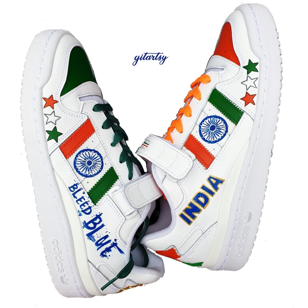 Hand-painted Adidas sneakers with Indian tricolour design and Ashoka Chakra, “Bleed Blue”, INDIA lettering, and BCCI logo & Patriotic India-themed fan sneakers with cricket art and star motifs & Gitartsy painted India shoes with saffron, green and white colour blocks