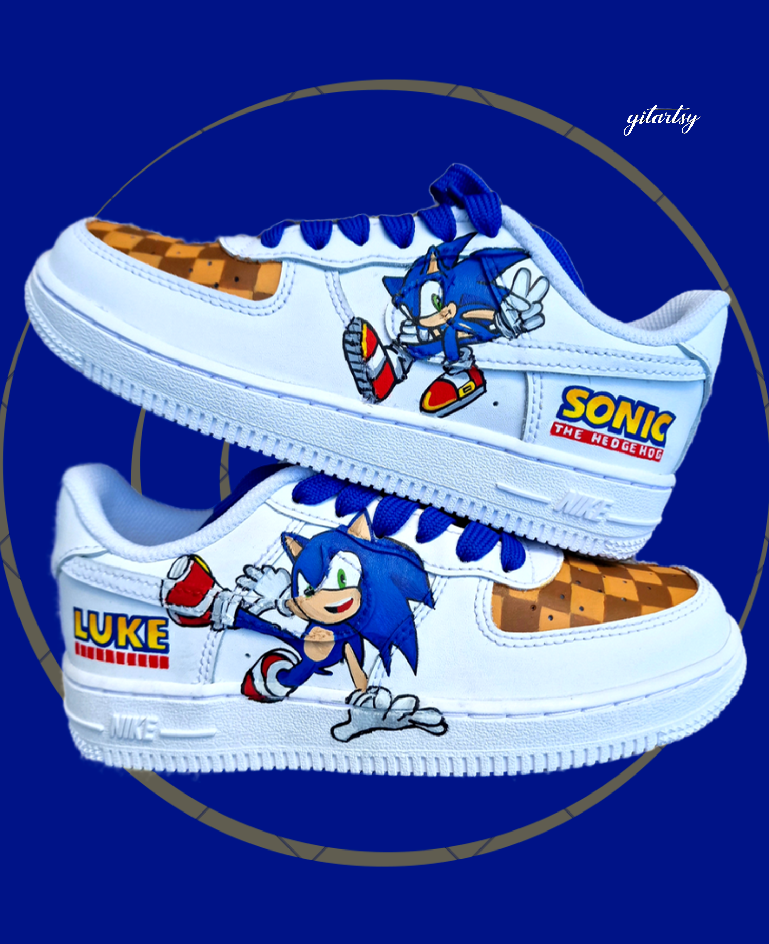 Custom white Nike Air Force 1 kids sneakers featuring vibrant hand-painted Sonic the Hedgehog character artwork on the sides, personalized heel name "Luke", blue laces, and brown checkered patterns inspired by Sonic’s Green Hill Zone, designed by Gitartsy.