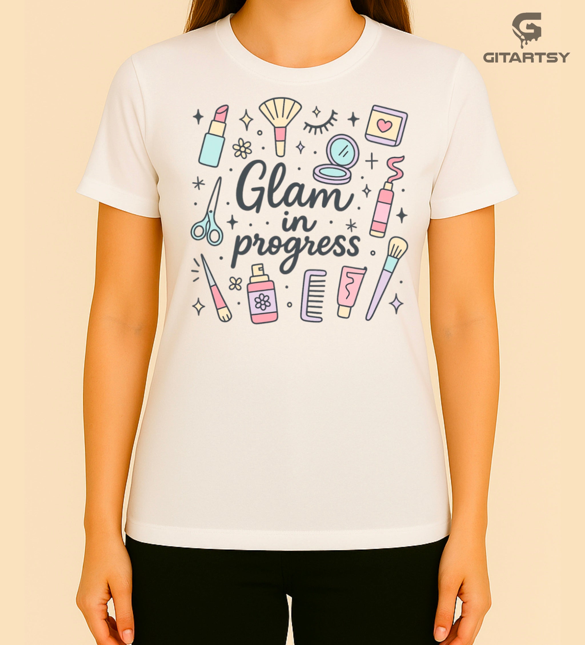 T-shirt featuring pastel makeup illustrations and the phrase “Glam in Progress” – perfect for makeup artists and beauty professionals.
