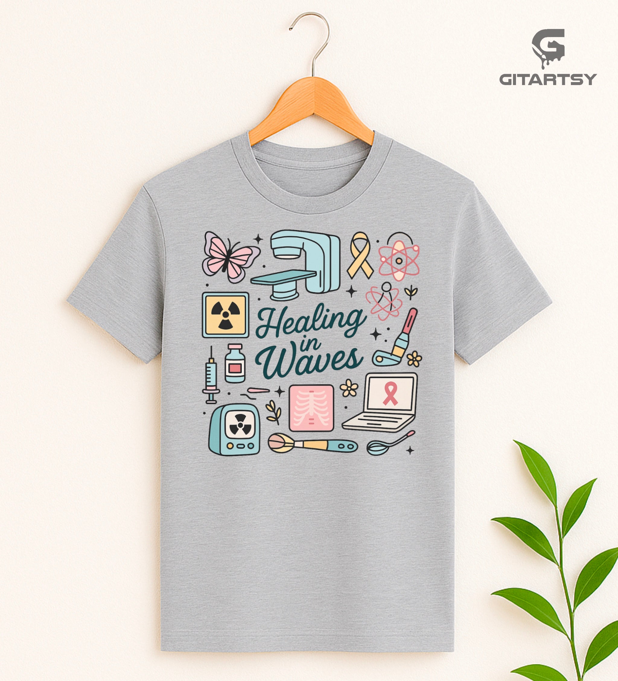 Radiotherapist pastel T-shirt with radiation icons, X-ray machine, and "Healing in Waves" text.