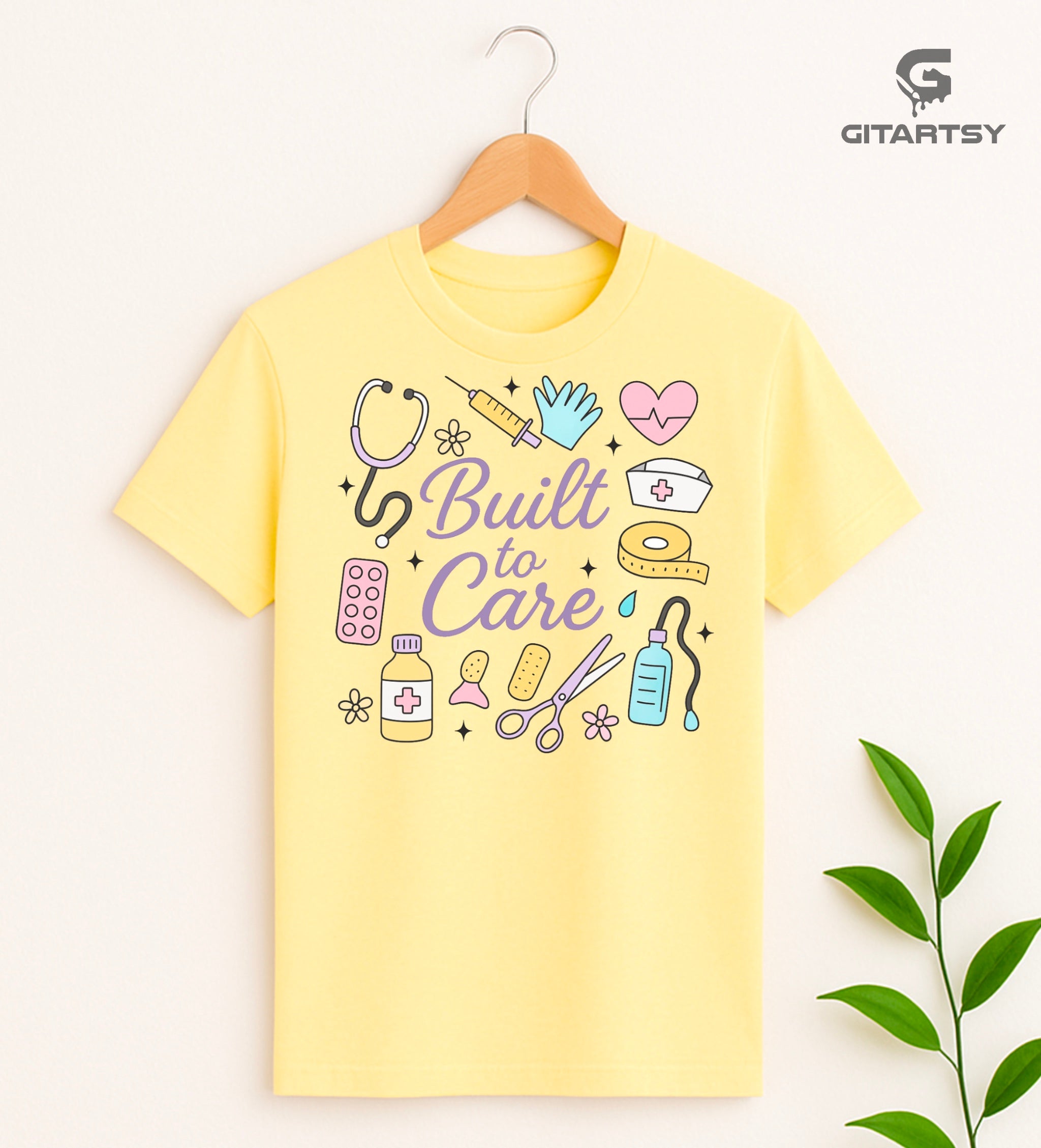 T-shirts reading “Here to Heal” and “Built to Care” featuring pastel illustrations of stethoscopes, syringes, gloves, pills, and medical equipment – ideal for nurses, doctors, and healthcare professionals.