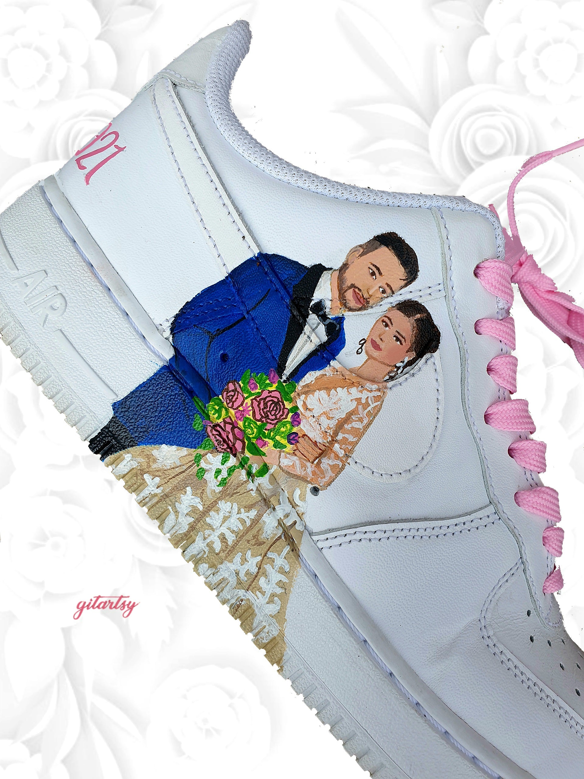 Custom hand-painted Nike AF1 sneakers featuring realistic Indian bride and groom portraits with floral accents and crystal embellishments