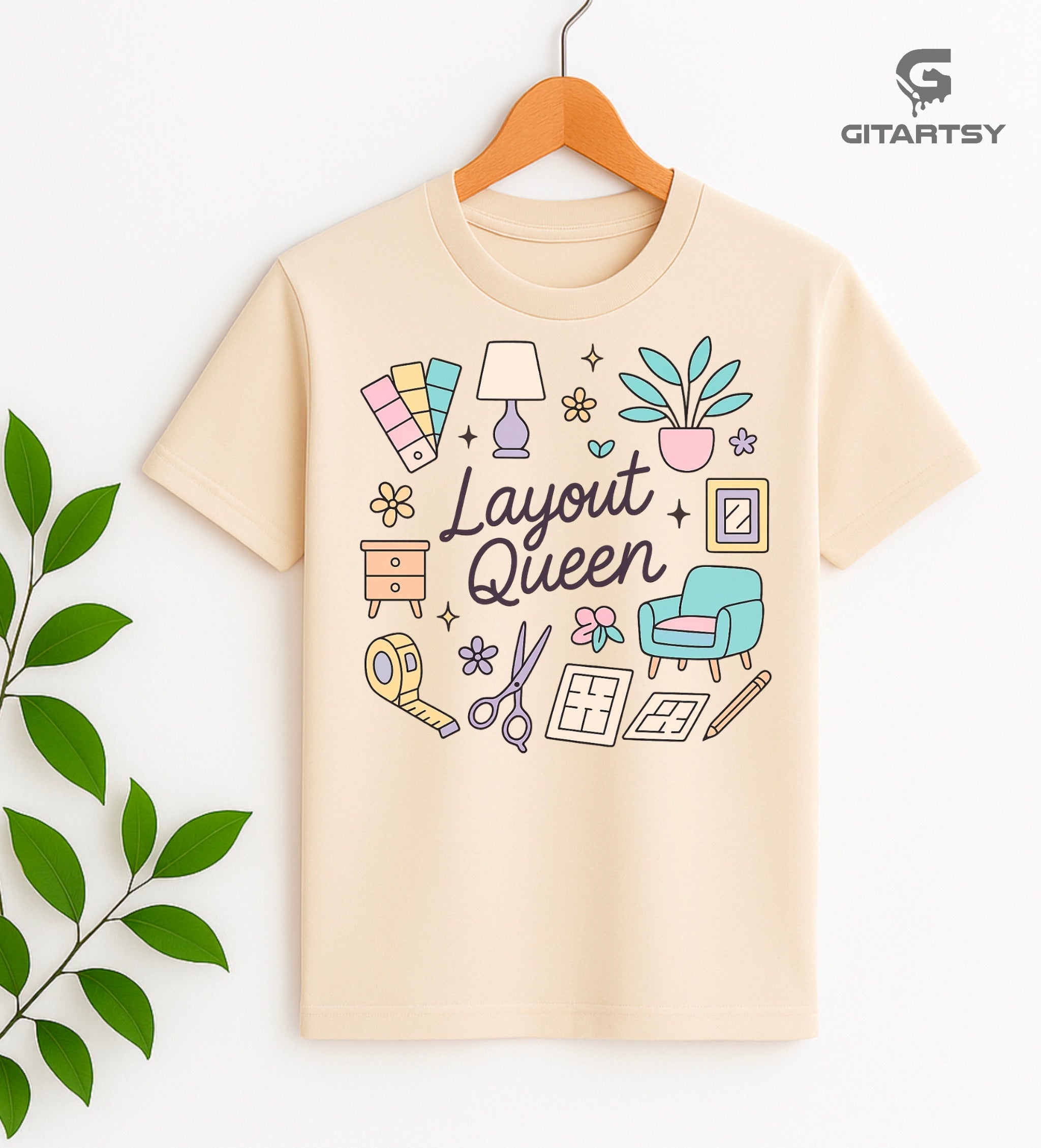 T-shirt featuring the quote "Layout Queen" with pastel icons of interior design elements such as a lamp, swatches, plants, layout plans and furniture – ideal for interior designers and home stylists.