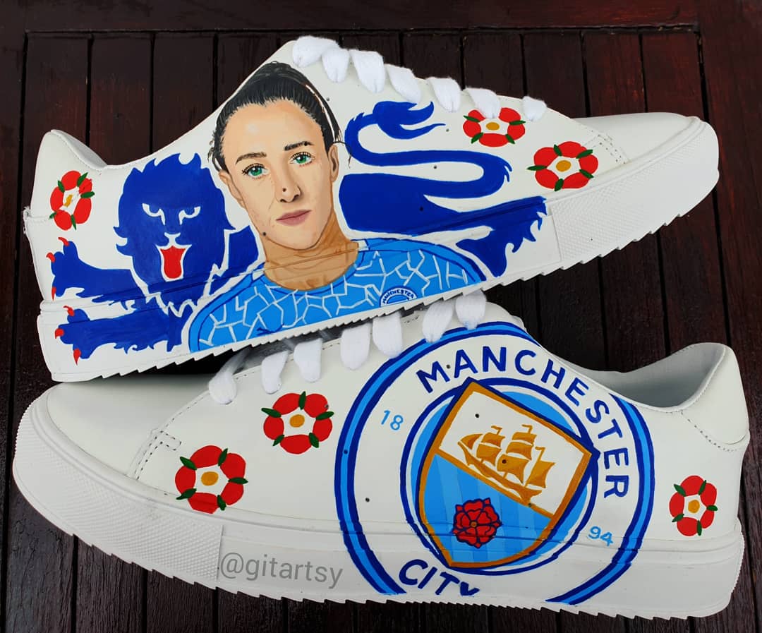 Custom Lucy Bronze Manchester City Hand-Painted Sneakers featuring a realistic portrait of Lucy Bronze, blue club lion emblem, red English rose details, and the iconic Manchester City logo, painted on premium white leather shoes – a unique gift for football fans.