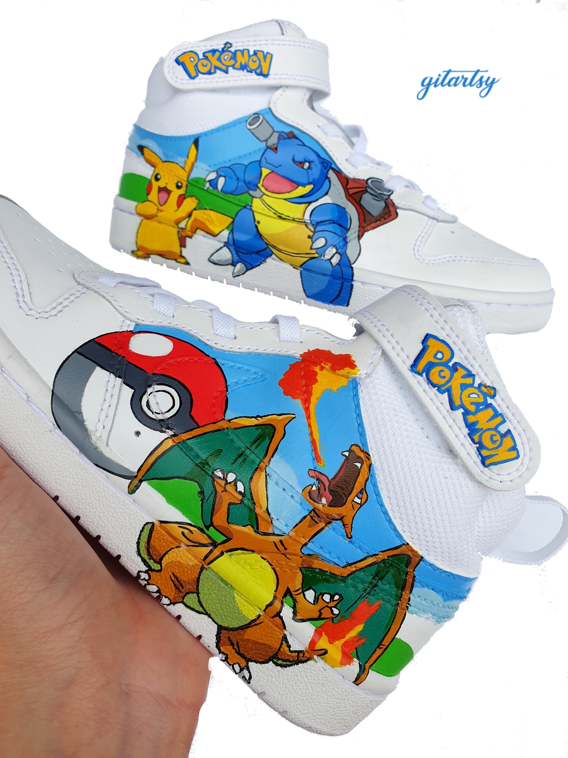 Custom hand-painted Pokémon Nike AF1 Kids Sneakers featuring detailed portraits of Pikachu, Charizard breathing fire, and Blastoise with cannons, along with a Pokéball and vivid backgrounds. Each pair is individually painted on white Nike Air Force 1 high-tops with vibrant, waterproof, crack-resistant paints and a protective sealant for long-lasting colour. The Pokémon logo appears on the velcro strap, making them the perfect wearable artwork for young Pokémon fans and collectors.