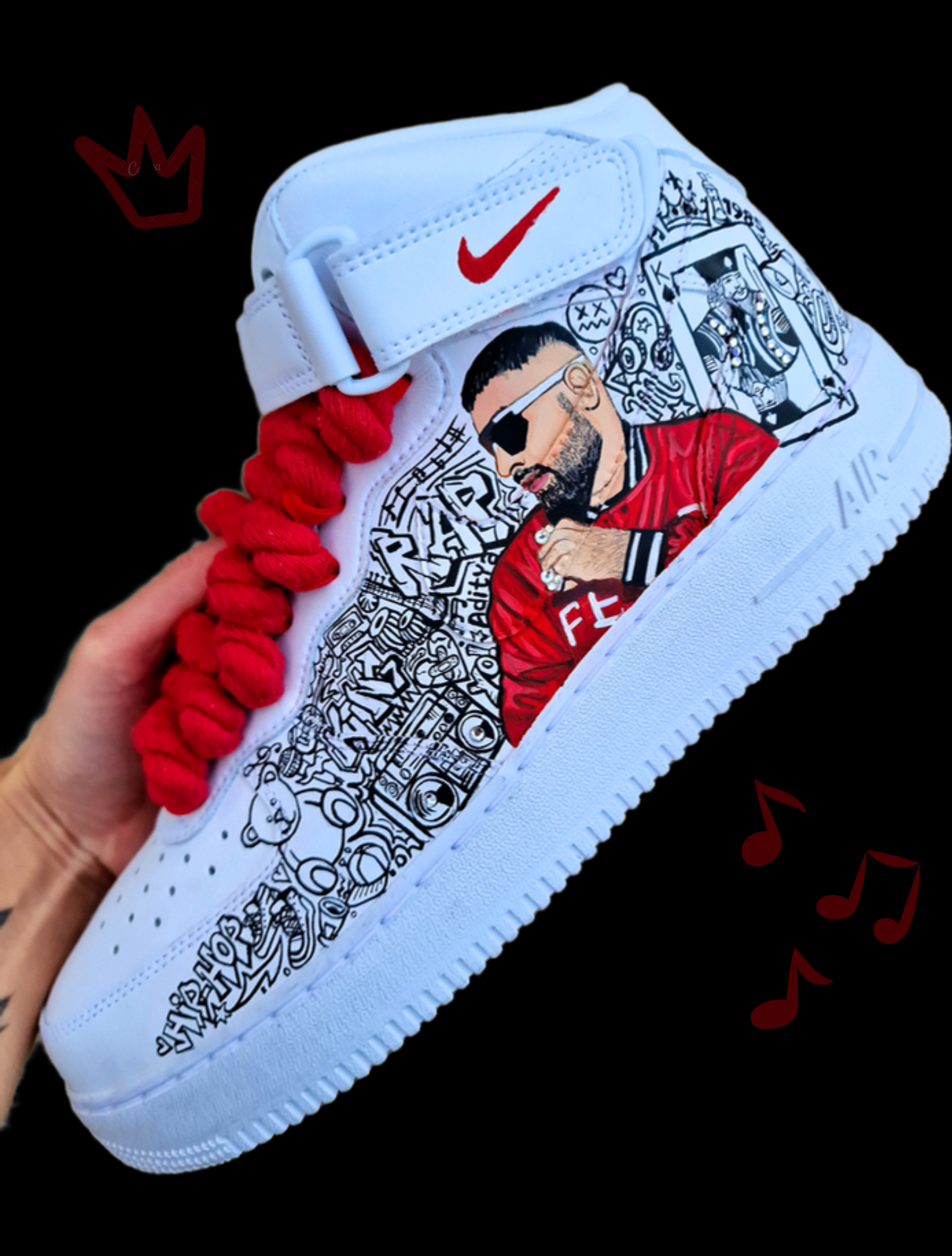 Custom white Nike Air Force 1 sneakers hand-painted with Badshah rapper artwork featuring graffiti-style “It’s Your Boy Badshah” text, detailed black and red music-themed illustrations, crown graphics, “Badworld” text, and bold red shoelaces — a unique tribute to Indian hip-hop culture.