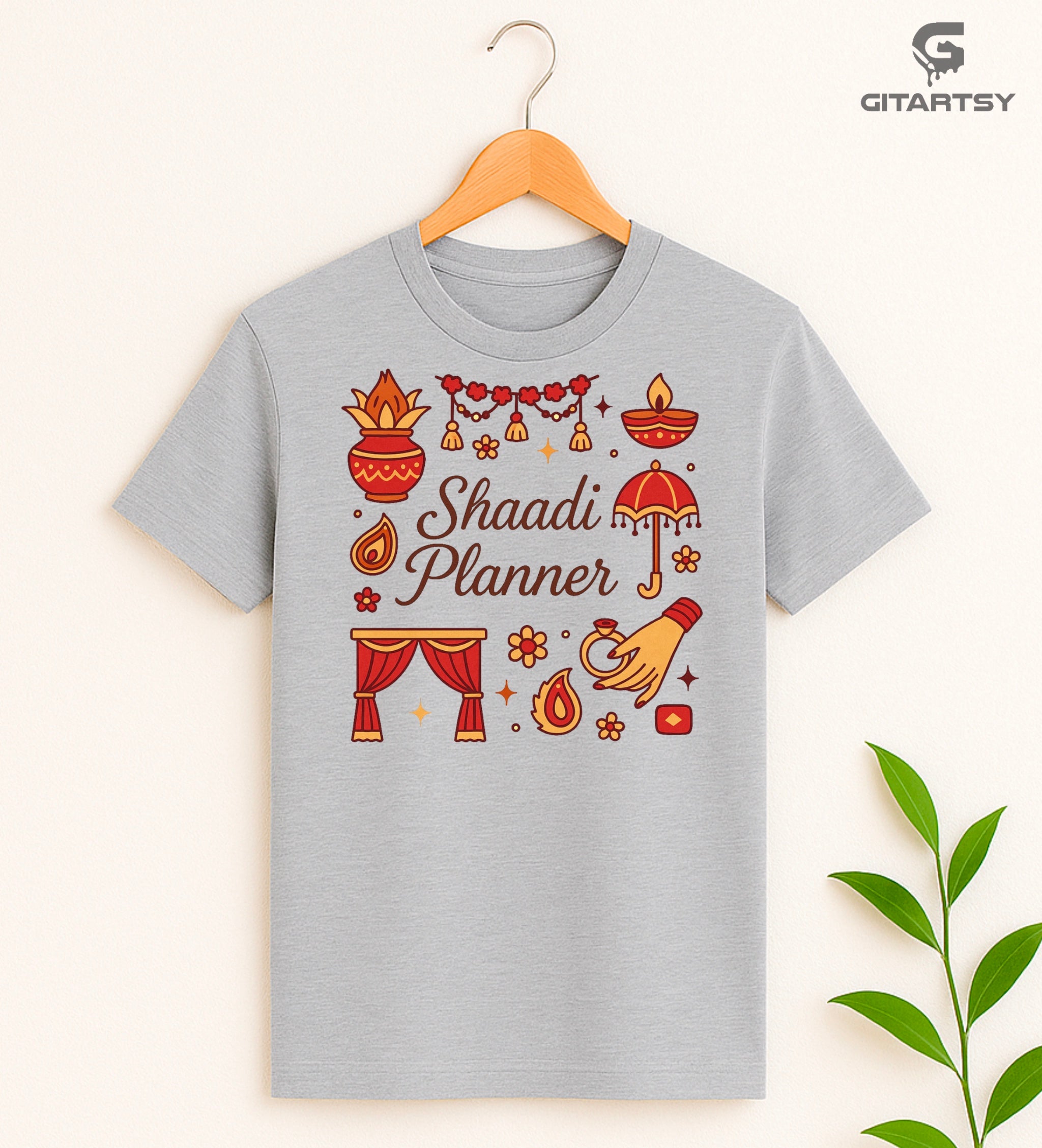 T-shirt with Shaadi Planner text and Indian wedding icons like diya, kalash, mandap, and hand with ring – perfect for desi wedding planners