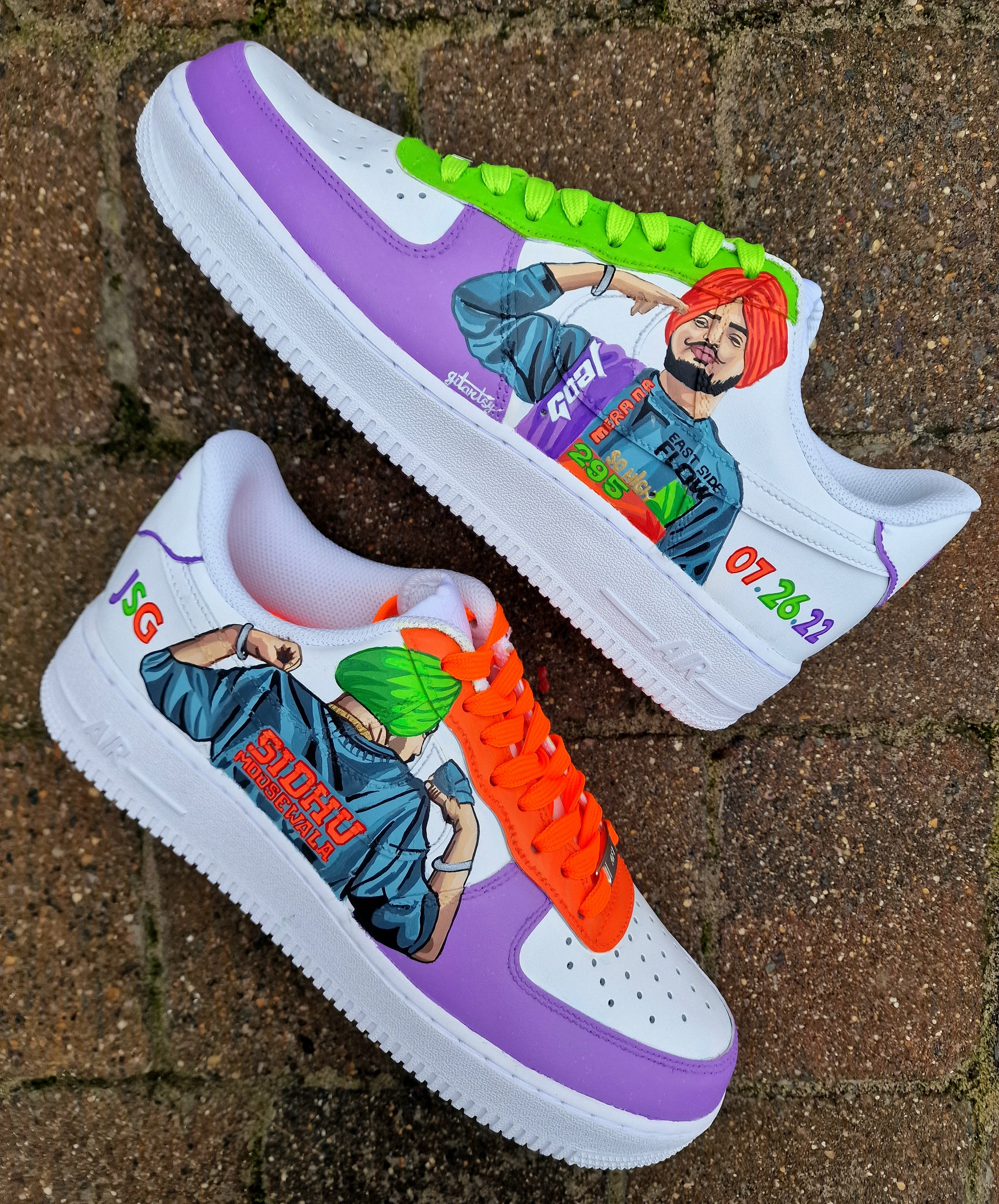 Custom white Nike Air Force 1 sneakers featuring hand-painted, realistic portraits of Sidhu Moosewala. Includes neon colors like bright green, orange, and purple, with lyrical references to his hit songs “295”, “So High”, and “East Side Flow”. Painted by Gitartsy, this wearable art also includes his name, tribute date “07.26.22”, and signature bold streetwear vibes.