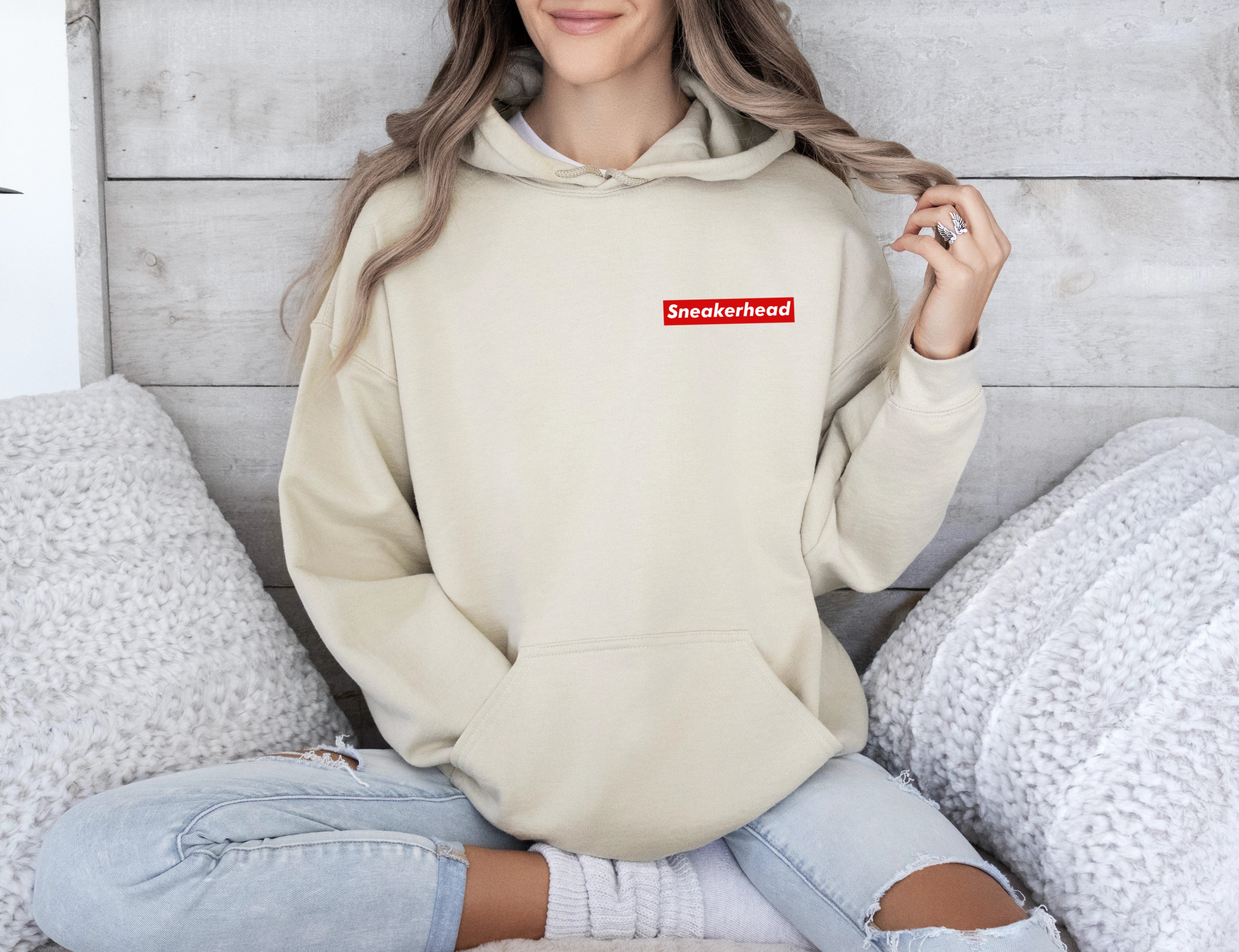 Beige hoodie for sneaker heads with minimal red rectangle sleek and minimal design inspired by supreme
