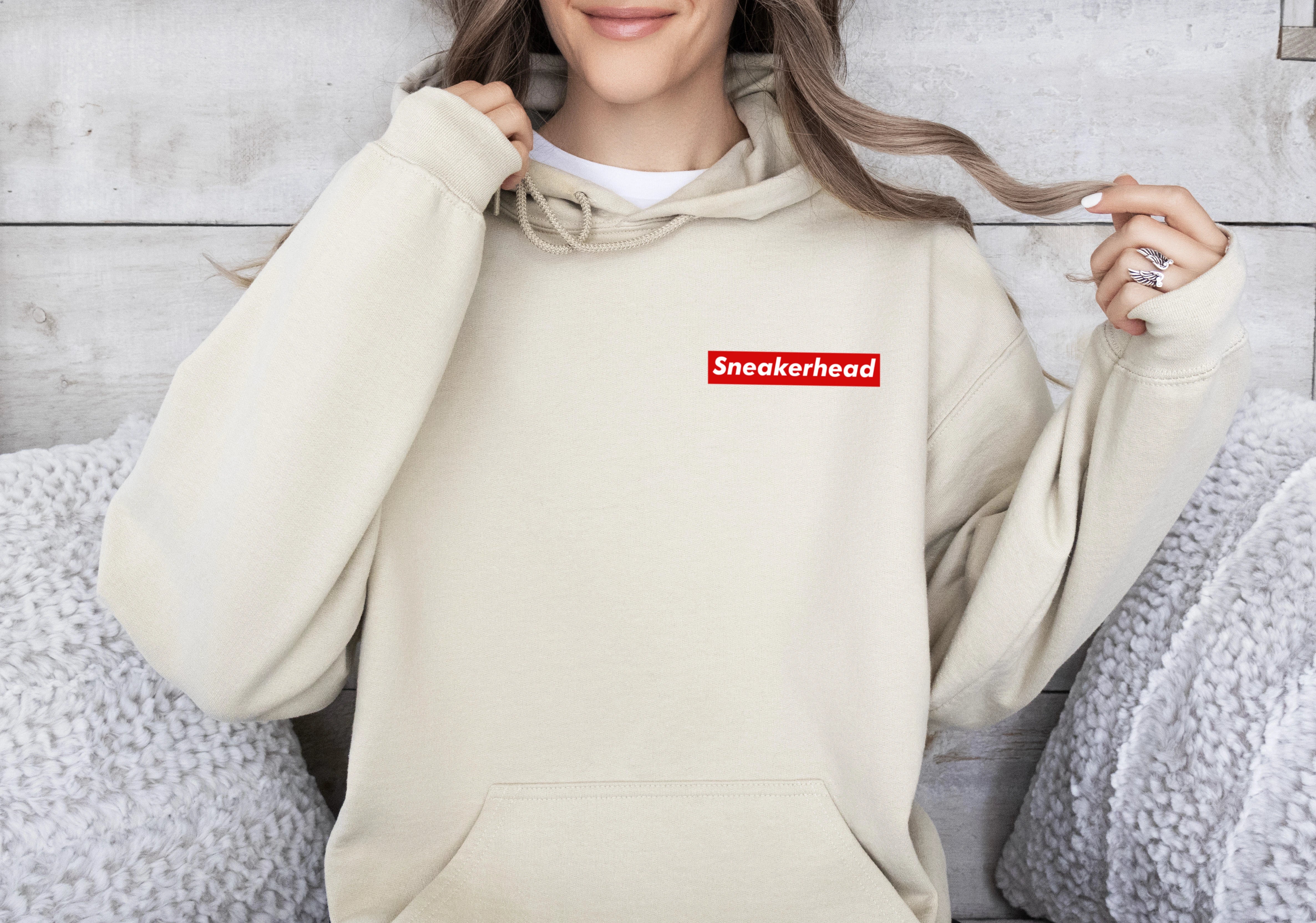 Beige hoodie for sneaker heads with minimal red rectangle sleek and minimal design inspired by supreme