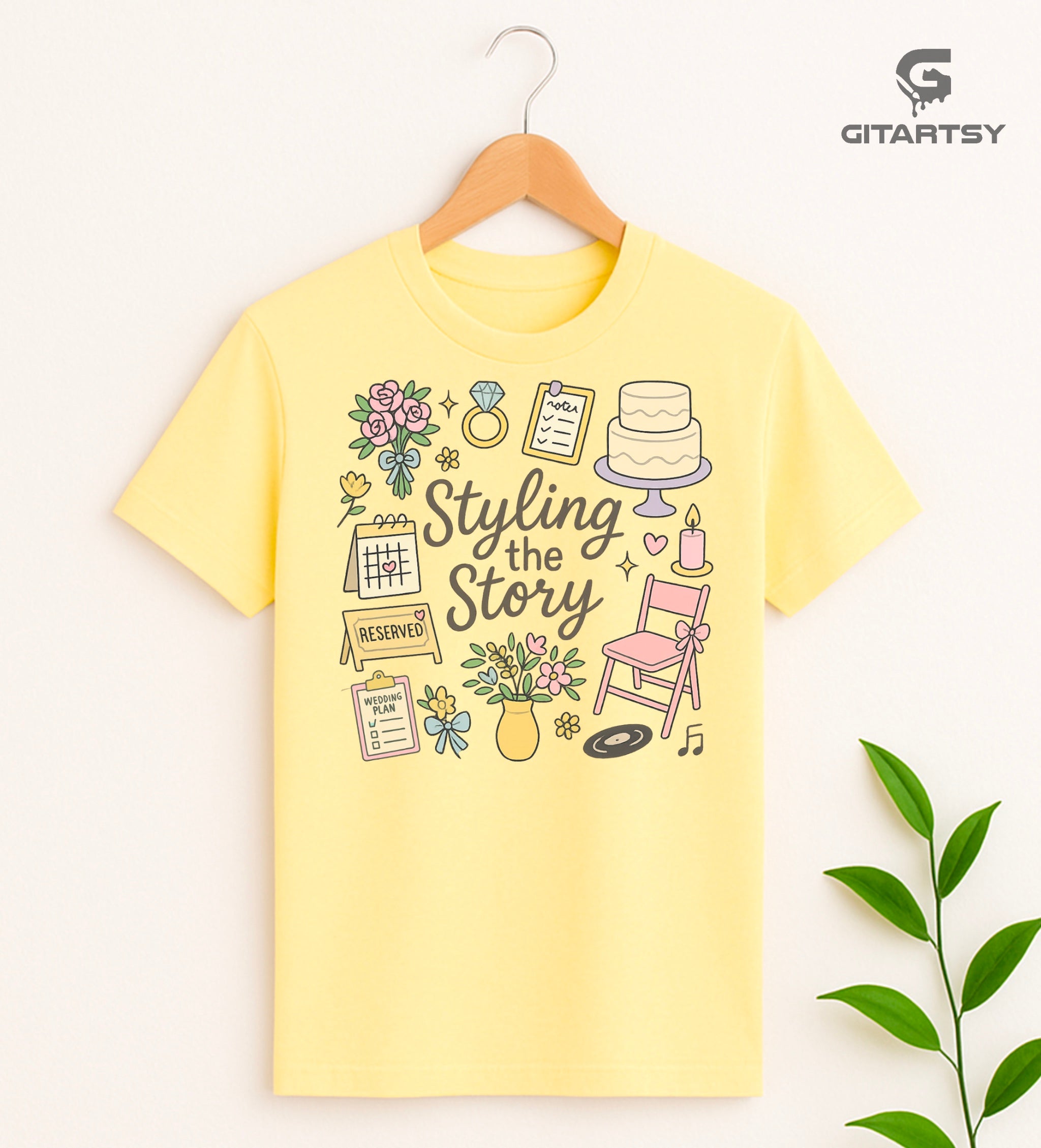 T-shirt featuring the quote "Styling the Story" surrounded by pastel illustrations of wedding flowers, calendar, RSVP notes, cake, chair, ring, and planner icons – perfect for bridal stylists and wedding planners.