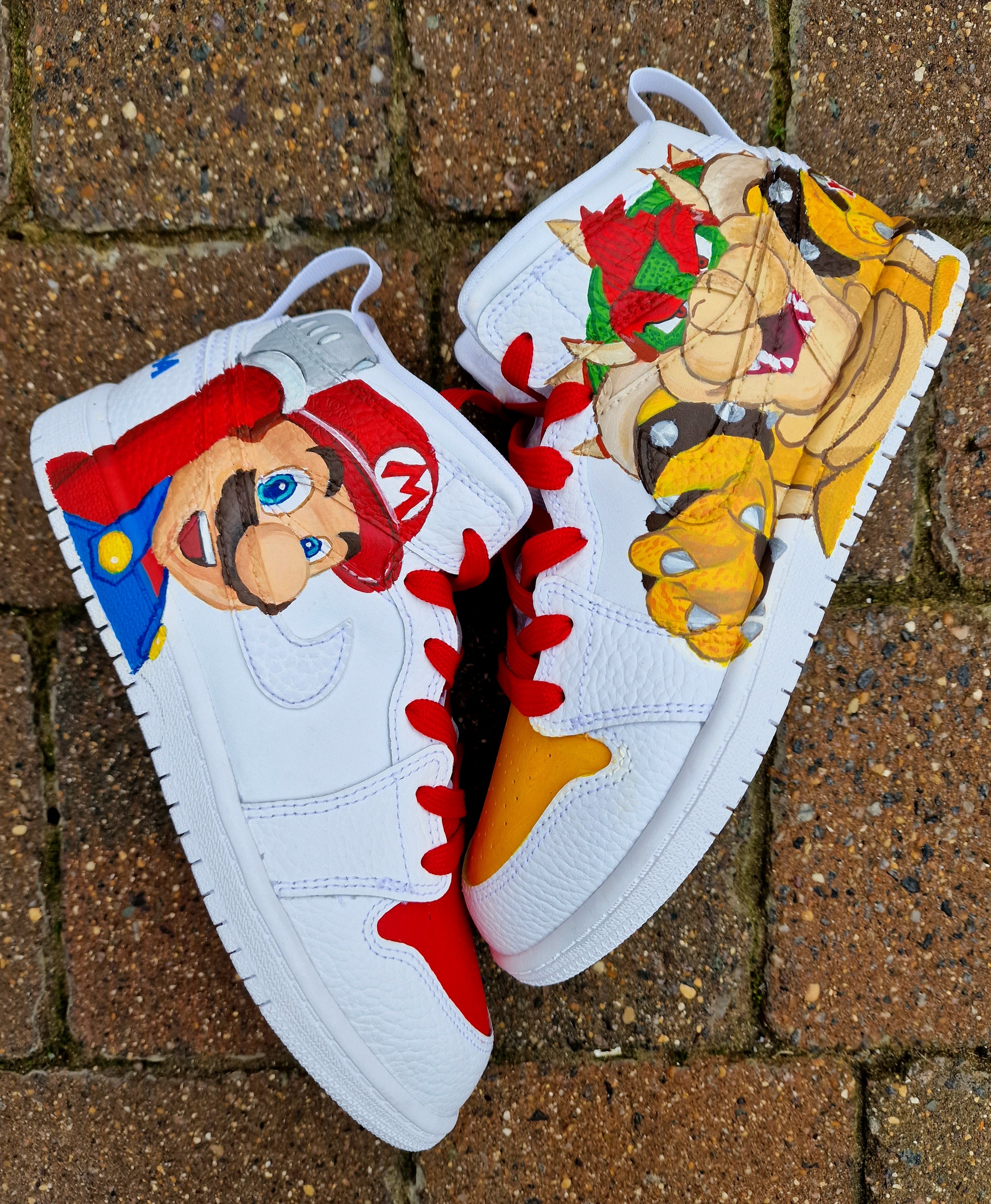 Hand-painted custom kids sneakers featuring vibrant Super Mario artwork with Mario and Bowser characters on a high-quality leather Jordan-style base, red and yellow detailing, and optional name customisation, created by Gitartsy.