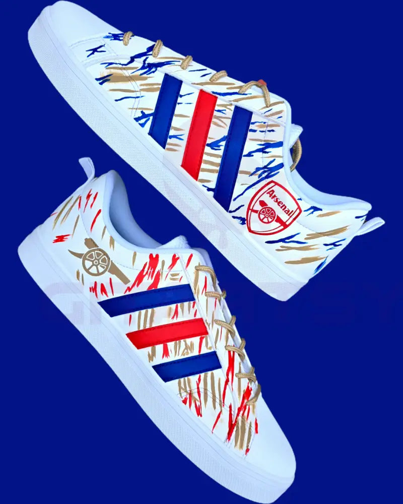 Arsenal FC Football Custom Hand-Painted Adidas Sneakers - white base shoes with  red blue and gold artwork inspired by Arsenal football club. Painted with bold brushstrokes