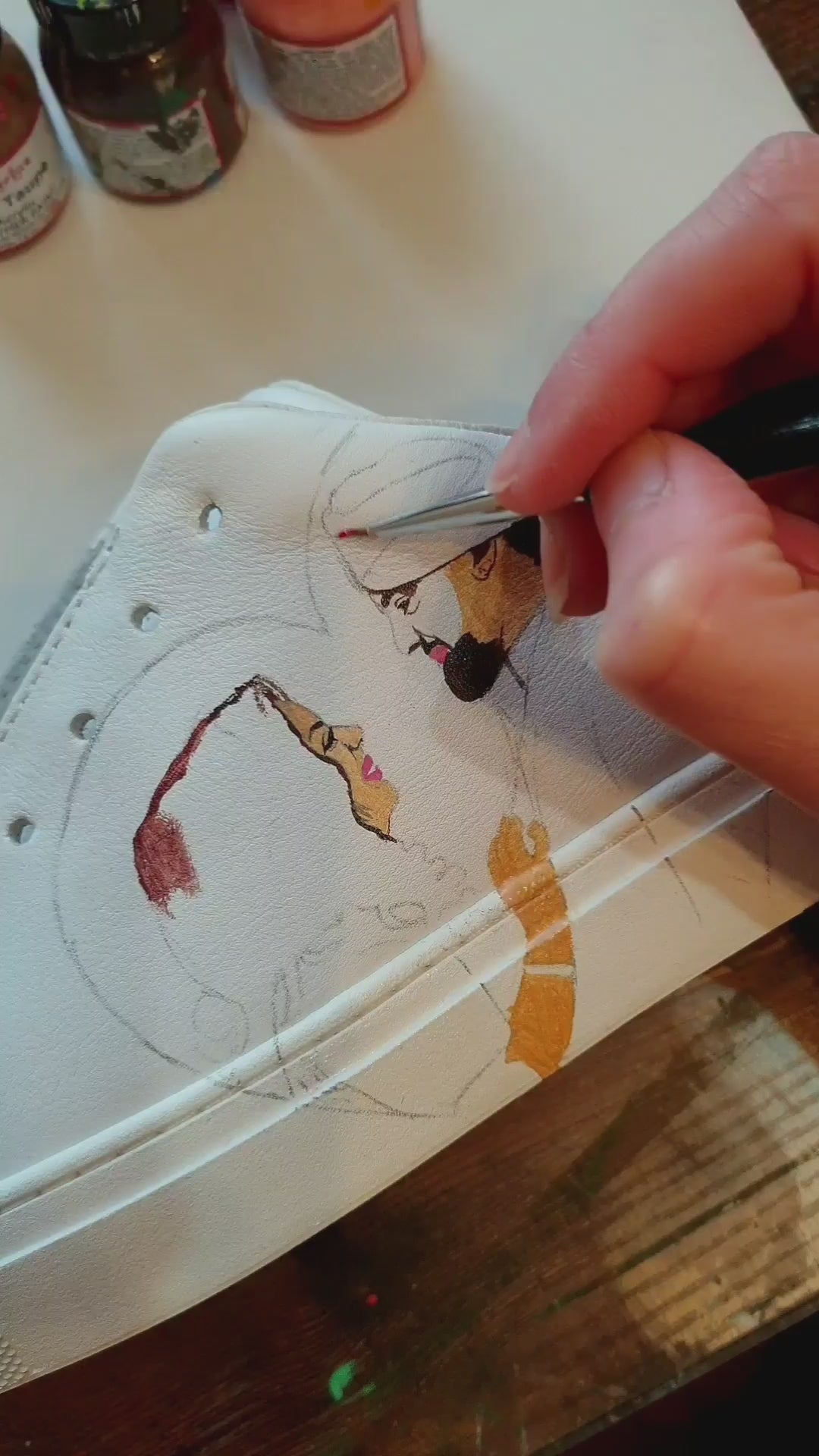 Custom painted sneakers featuring Sikh couple with realistic portraits  - painting process
