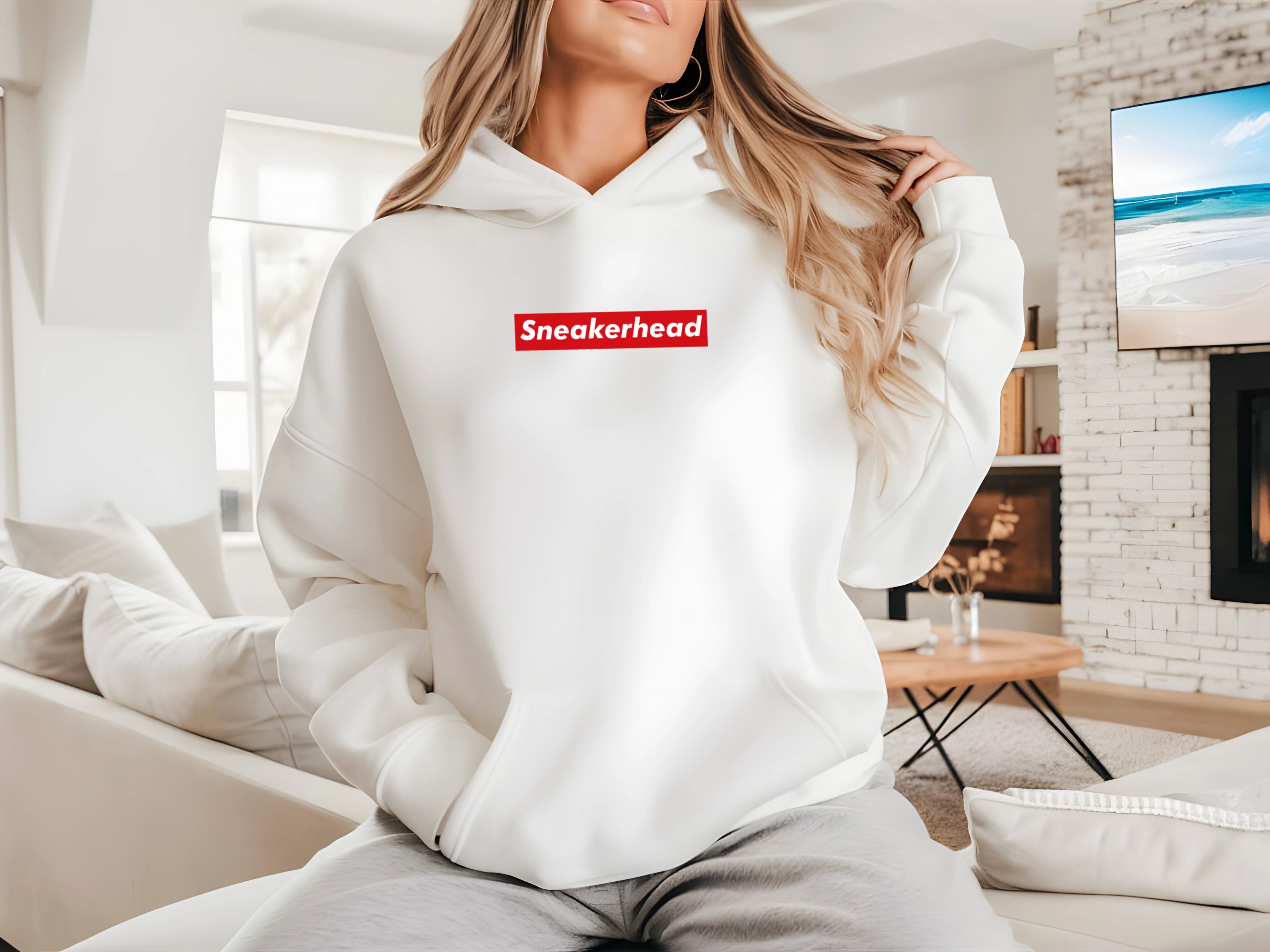 sneakerhead hoodie inspired by supreme with a sleek red rectangle design on a white hoodie with the word sneakerhead written