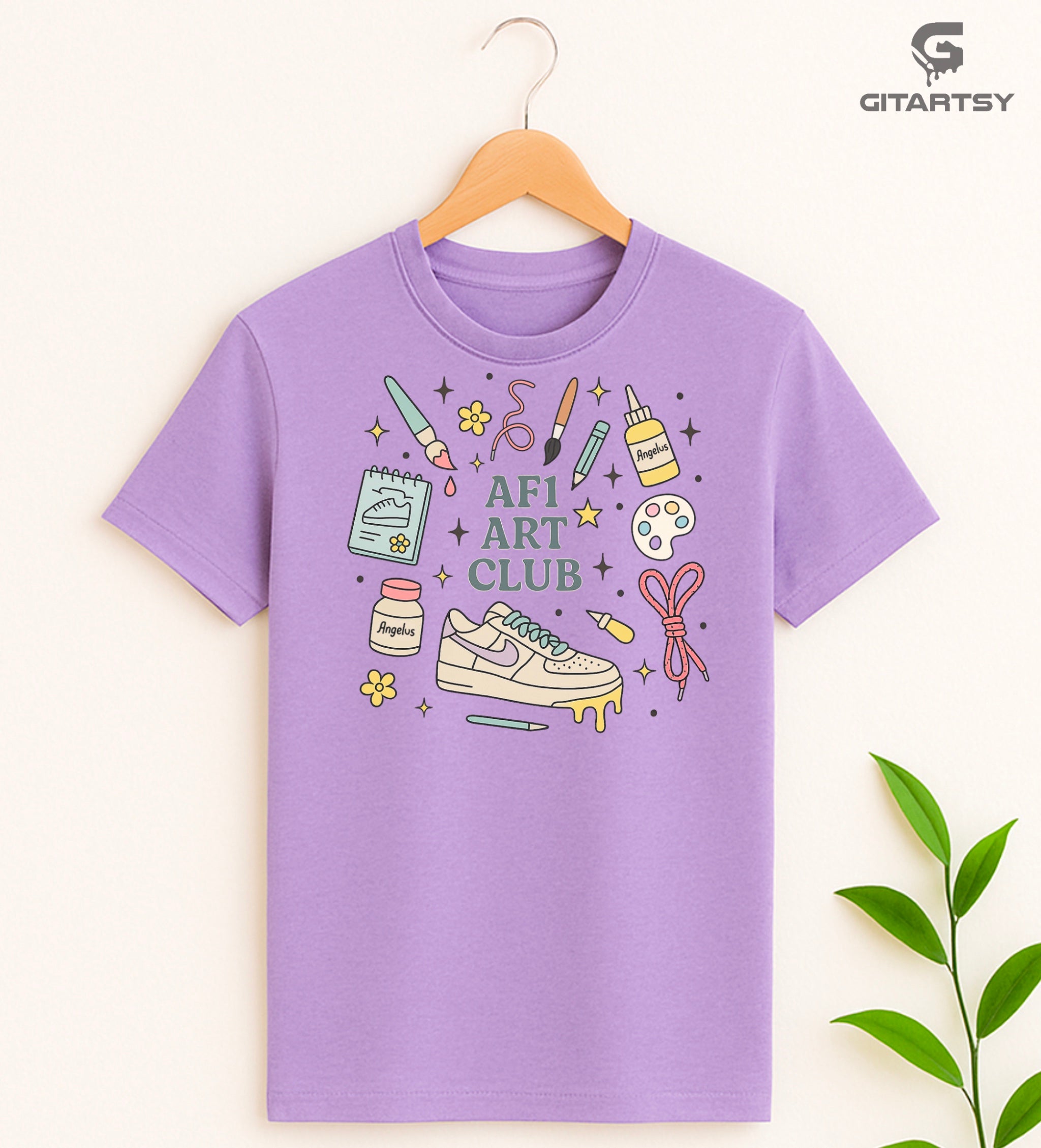 Pastel “AF1 Art Club” T-shirt featuring custom sneaker tools, Angelus paint bottles, laces, and AF1 art illustrations – perfect for shoe customisers and sneaker artists.