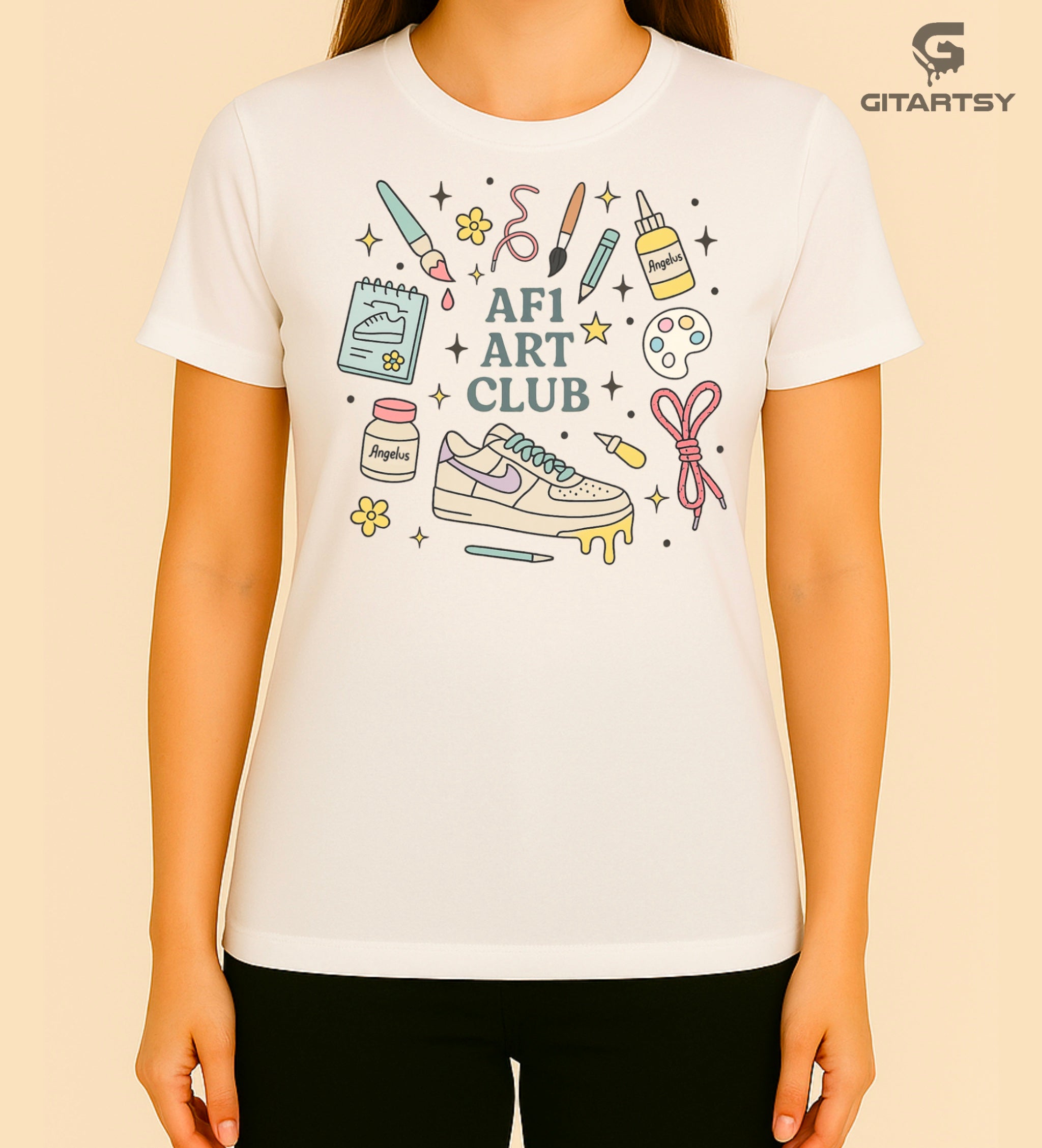 Pastel “AF1 Art Club” T-shirt featuring custom sneaker tools, Angelus paint bottles, laces, and AF1 art illustrations – perfect for shoe customisers and sneaker artists.