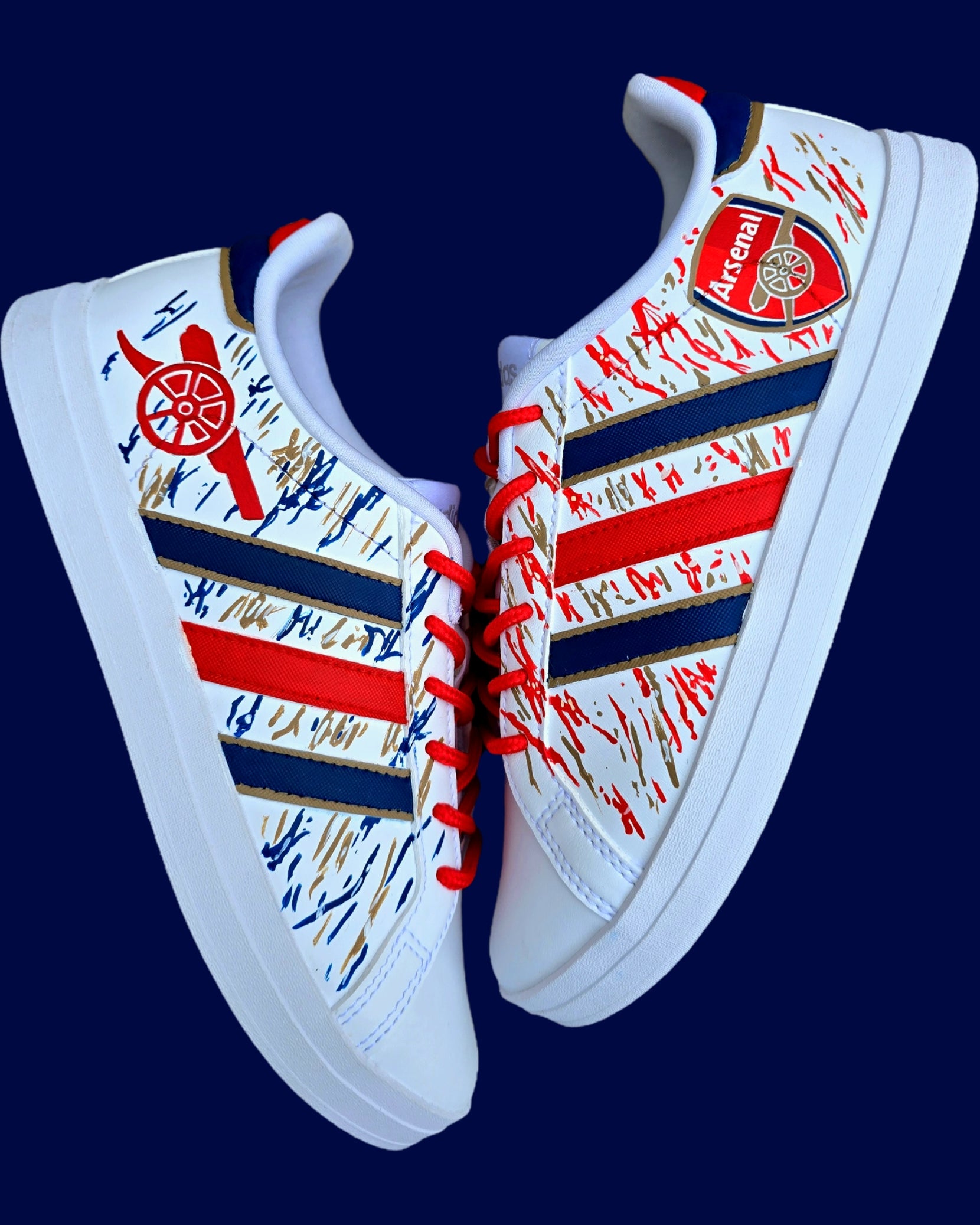 Arsenal FC Football Custom Hand-Painted Adidas Sneakers - Hand Painted with red, gold and blue artistic brushstrokes. Realistic arsenal fc logo and gunners logo