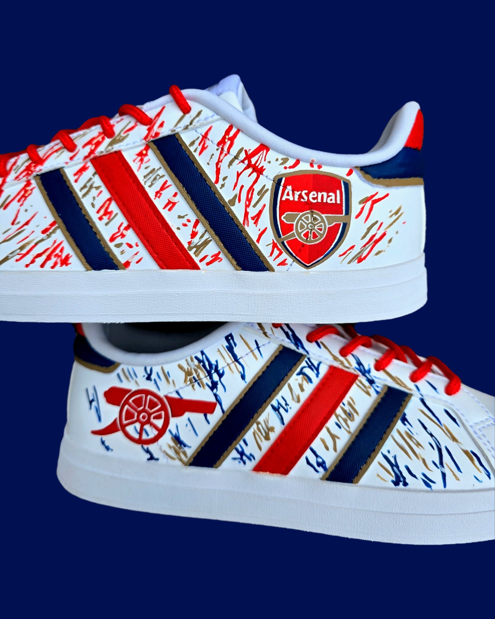 Arsenal FC Football Custom Hand-Painted Adidas Sneakers - Hand Painted with red, gold and blue artistic brushstrokes. Realistic arsenal fc logo and gunners logo