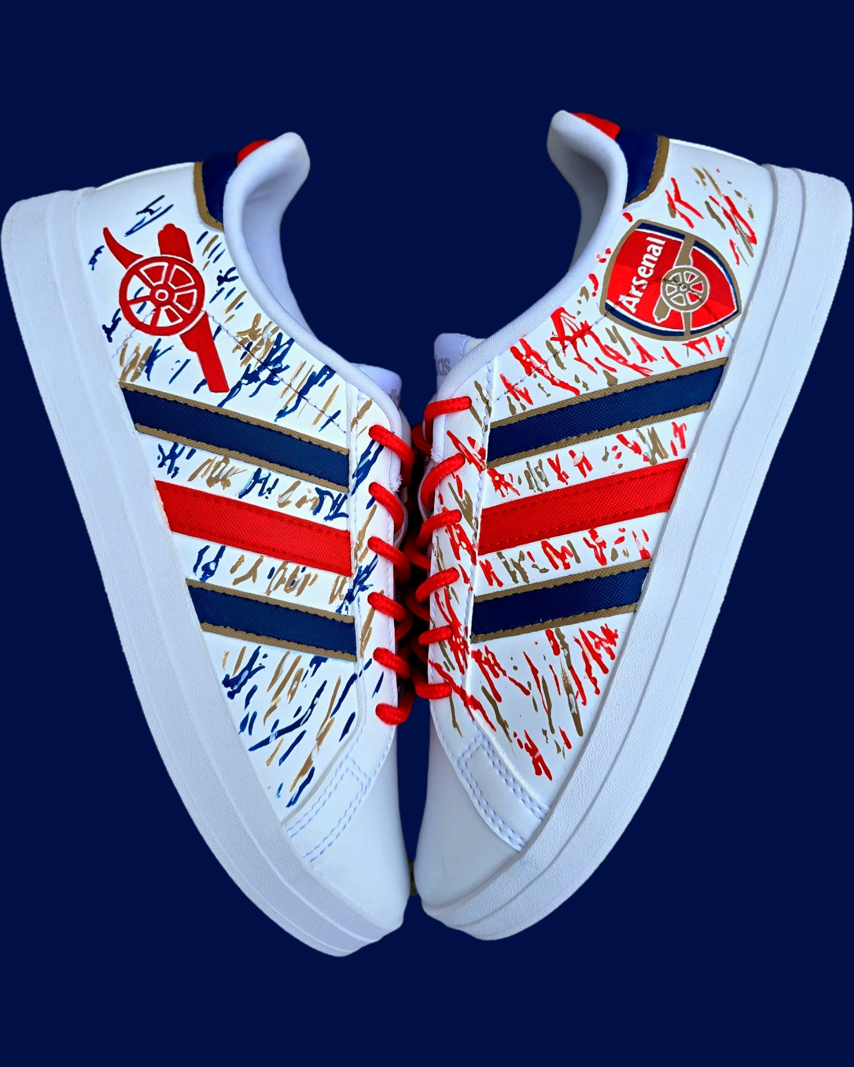 Arsenal FC Football Custom Hand-Painted Adidas Sneakers - Hand Painted with red, gold and blue artistic brushstrokes. Realistic arsenal fc logo and gunners logo