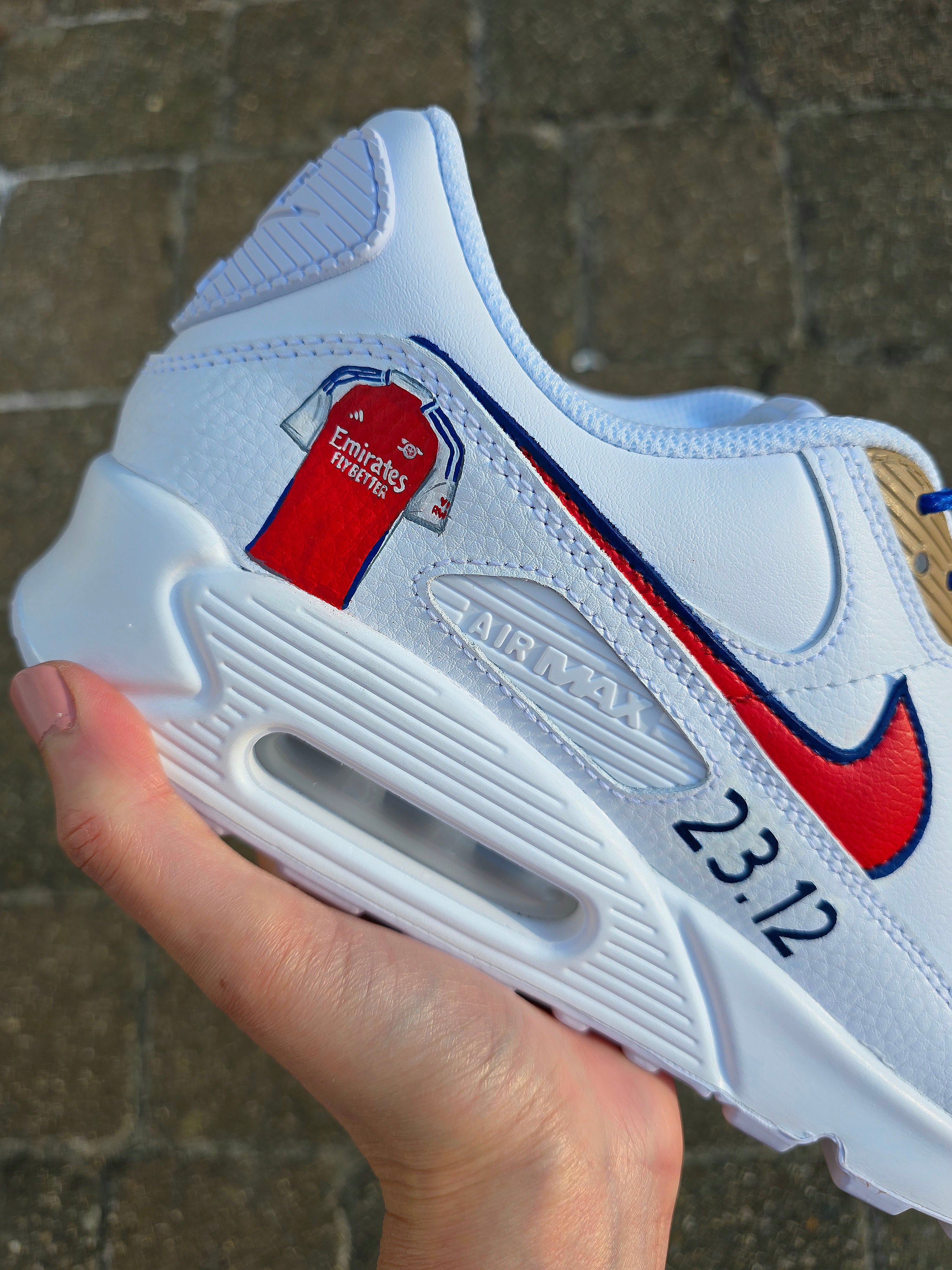 Custom hand-painted Nike Air Max sneakers featuring premium leather construction with intricate football club-themed artwork. Includes vibrant team colors, detailed logos, and personalizable options like initials, numbers, or dates. Waterproof and scratch-resistant for long-lasting wear. Ideal for sports fans, sneaker collectors, and as unique custom gifts. Designed with professional craftsmanship, blending fashion, comfort, and team pride.

