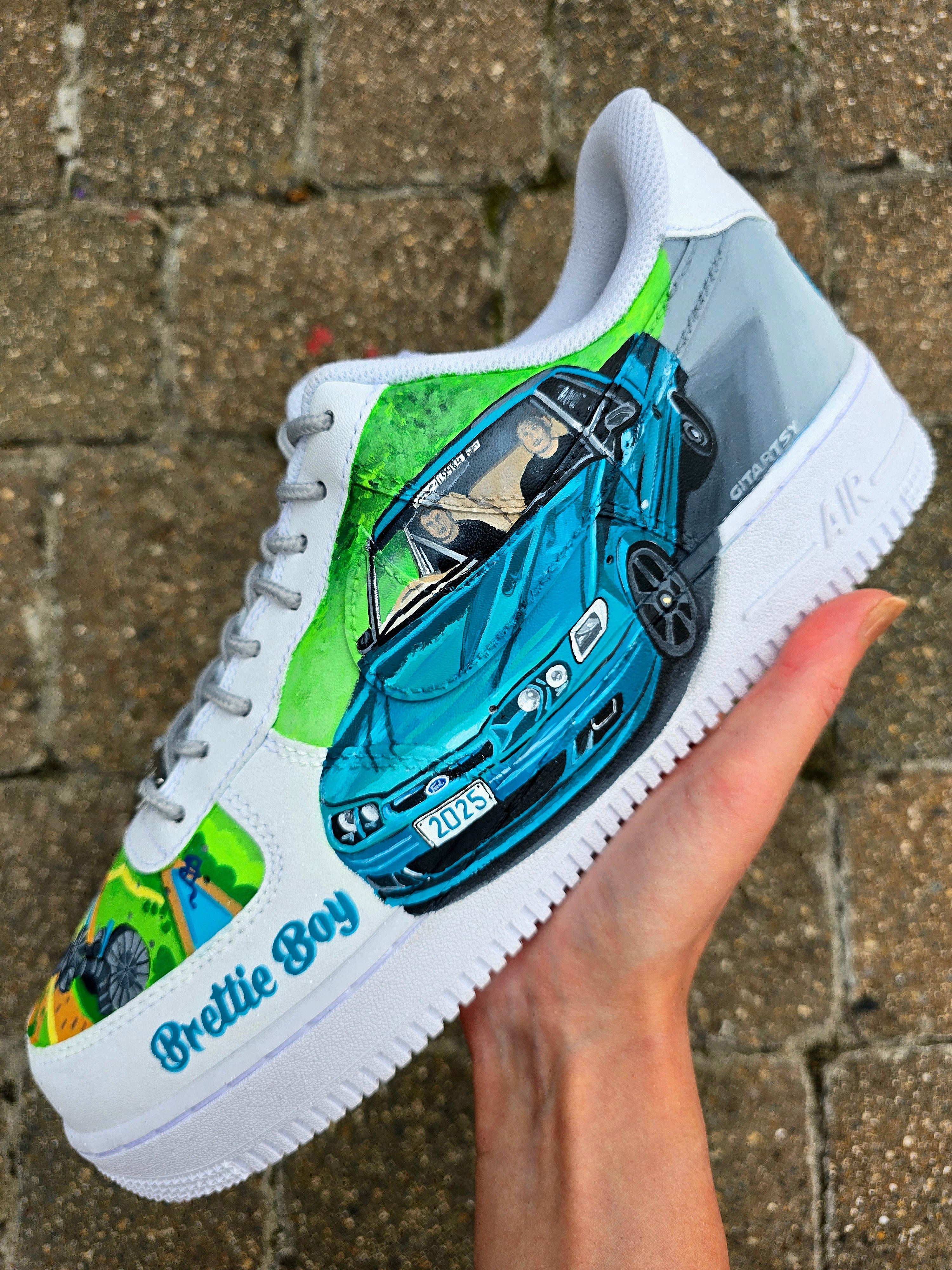 Custom hand-painted Nike Air Force 1 sneakers featuring a Lamborghini-inspired design 🏎️ and spray painter artwork 🎨. Created by Gitartsy using premium leather paints, sealed for durability, and fully customisable with personal details such as car models, colors, and text. Perfect for car enthusiasts 🚗, sneaker collectors 👟, and streetwear lovers seeking one-of-a-kind footwear.

