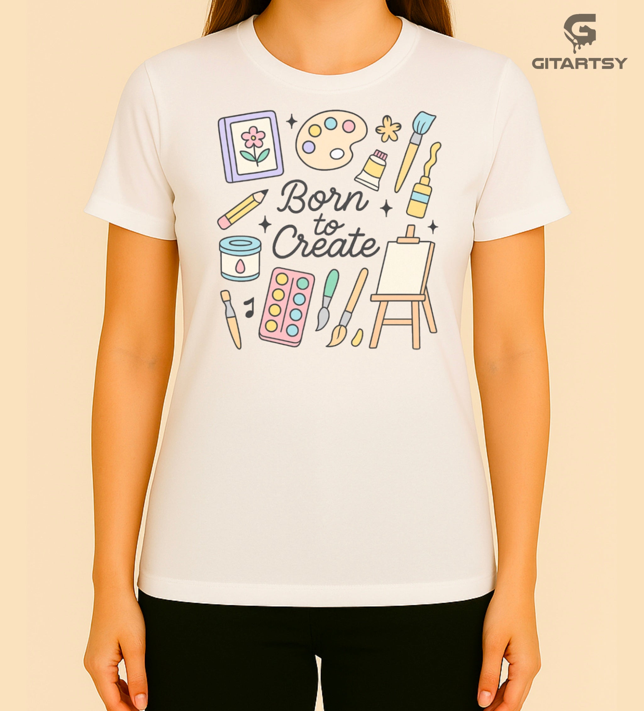 "Born to Create" pastel art T-shirt for fine artists with doodles of brushes, easel, paint tubes, and creative tools on a cotton tee