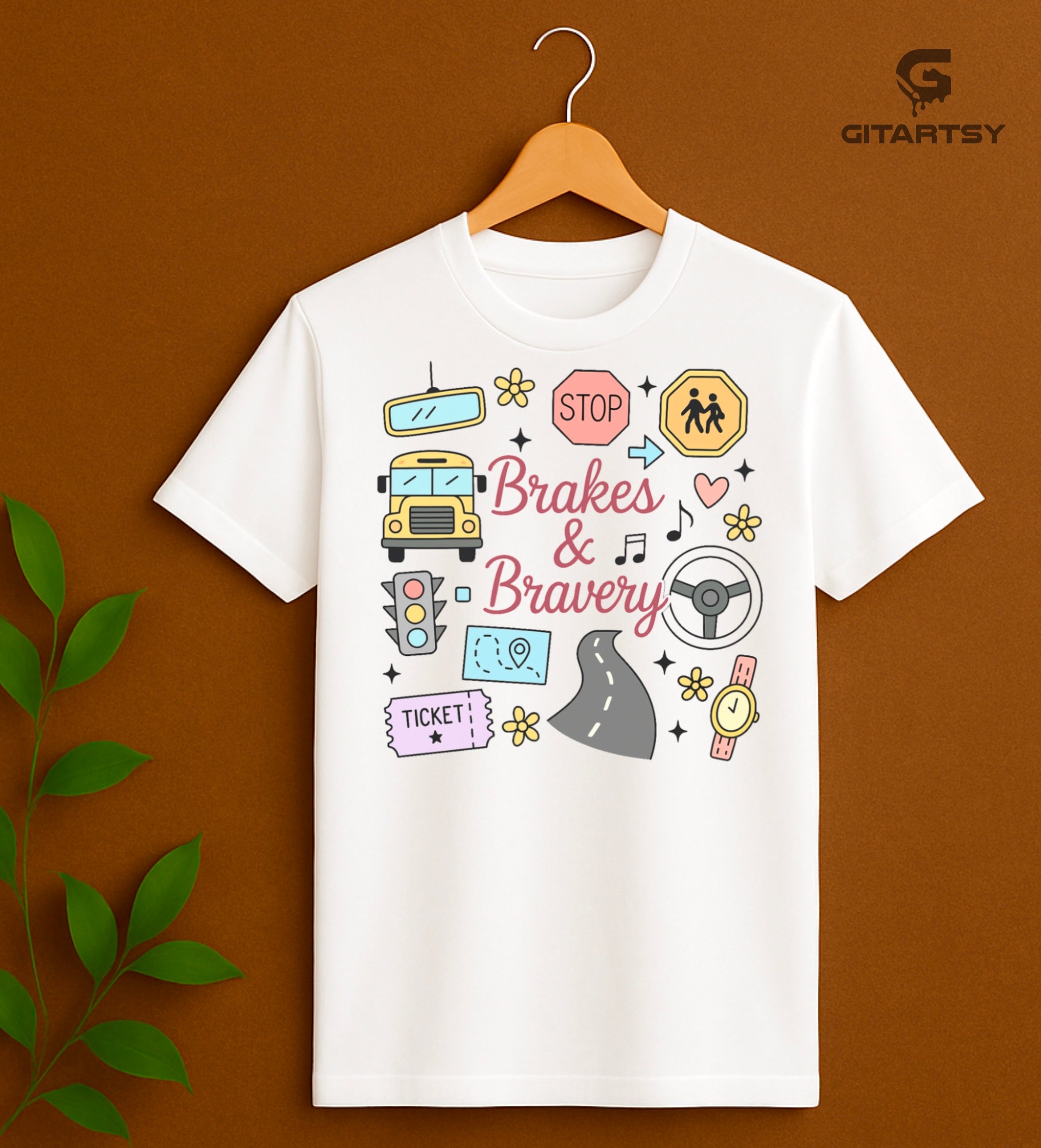 Pastel T-shirt with “Brakes & Bravery” design featuring illustrated school bus, road signs, steering wheel, and driving elements – ideal gift for bus drivers and transport staff