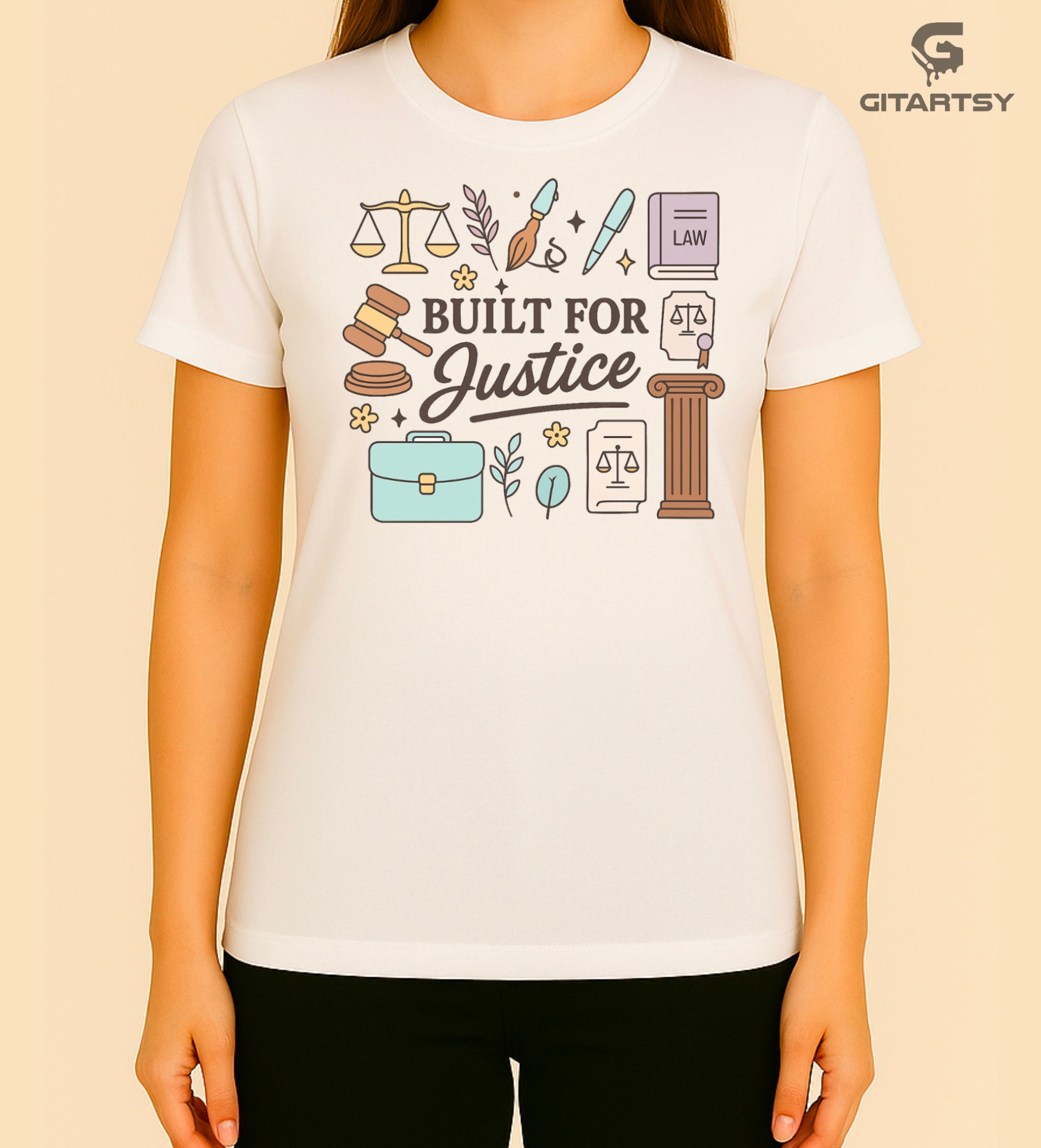 T-shirt featuring the quote "Built for Justice" surrounded by pastel legal icons like scales, gavel, law books, pens, briefcase, and courthouse pillar – ideal for lawyers and law students.