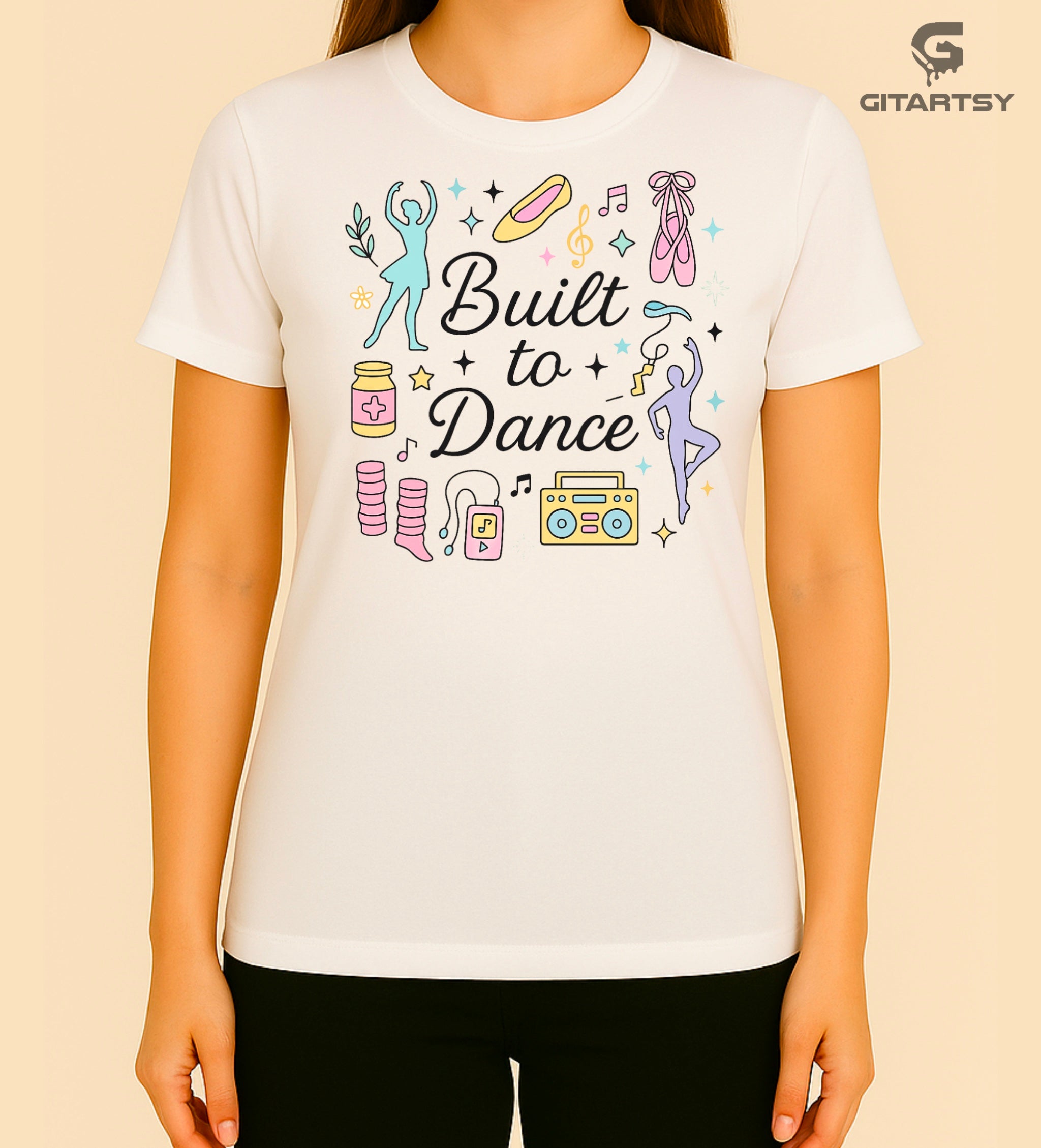 Pastel t-shirt with the phrase "Built to Dance" surrounded by dancer silhouettes, ballet shoes, leg warmers, and music symbols – ideal for dance lovers, choreographers, and teachers.