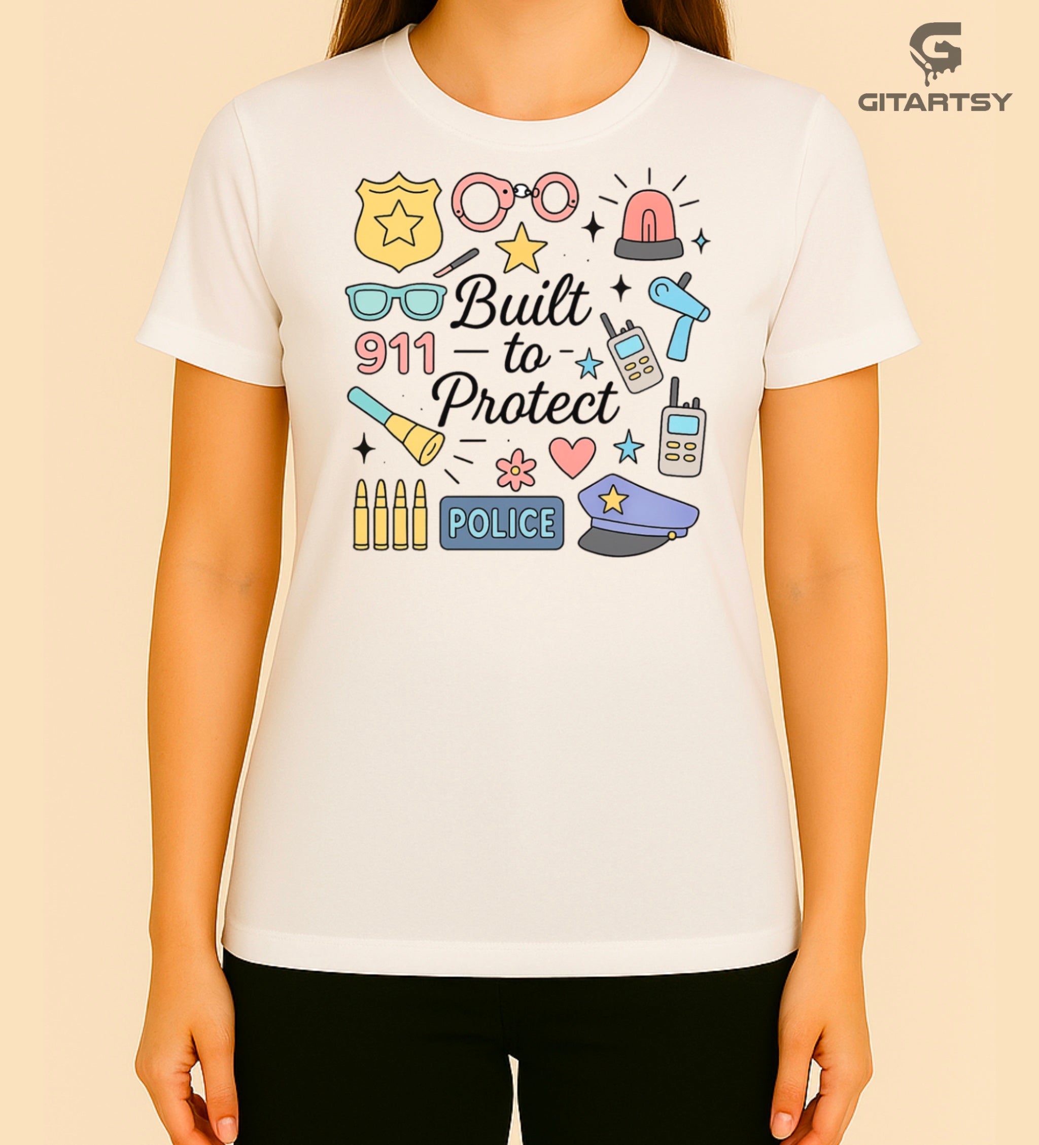 Pastel graphic T-shirt for policewomen with icons like badges, handcuffs, sirens, and 911 – “Built to Protect” slogan in stylish typography.