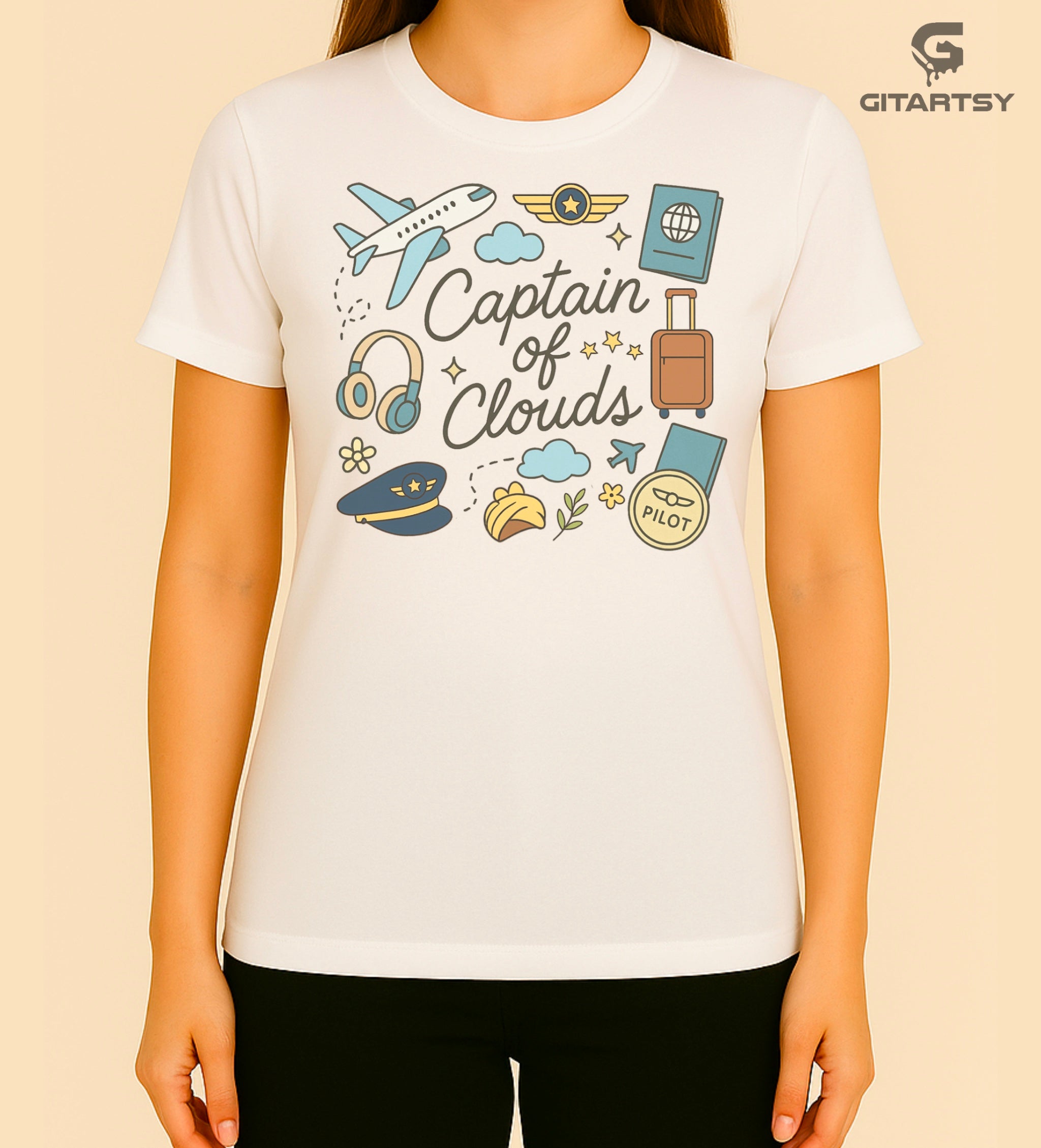 Pastel pilot-themed t-shirt with plane, cloud, headset, and travel icons. "Captain of Clouds" design for aviation lovers and airline crew.