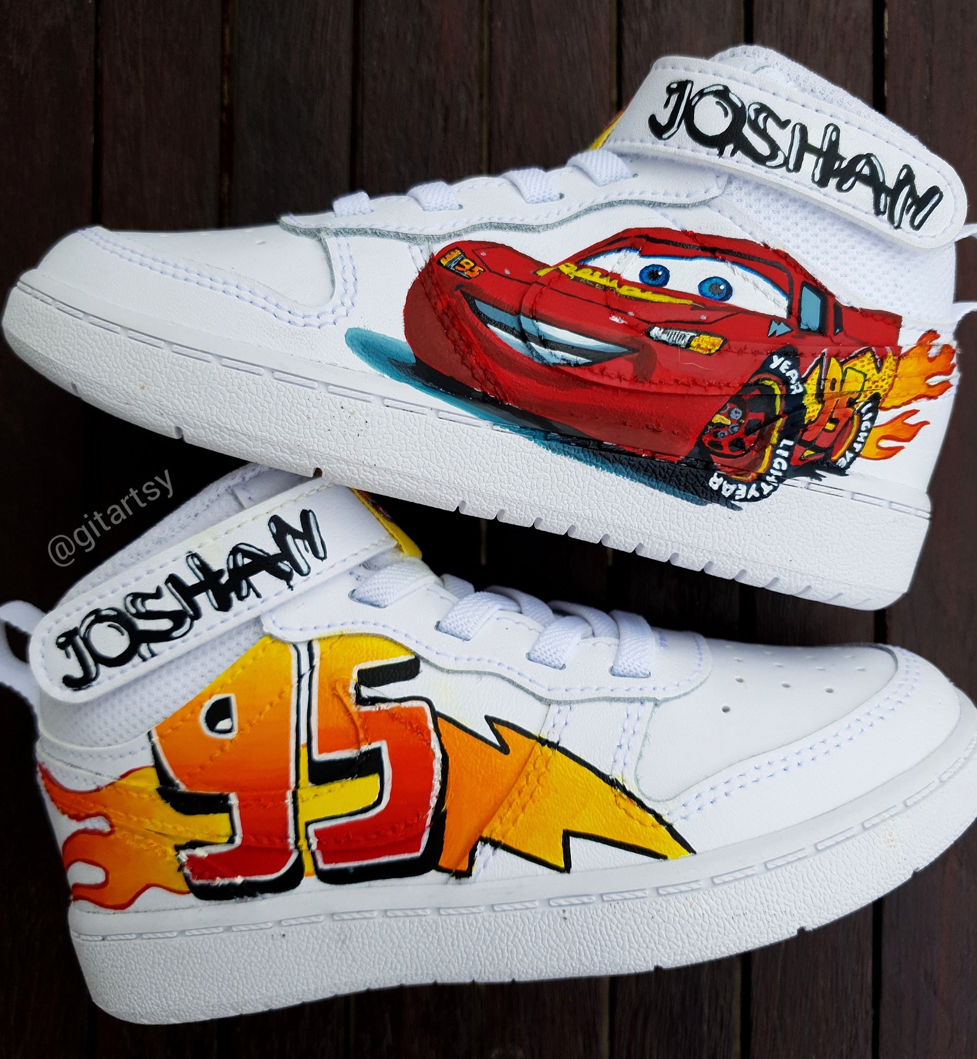 Custom hand-painted Nike sneakers for kids inspired by the Cars movie character Lightning McQueen. Features detailed artwork of the red race car, “95” lightning bolt graphics, and bright flame motifs, all sealed on genuine Nike shoes. Personalized with the child’s name, each pair is a unique, handcrafted tribute to speed and imagination. Durable, waterproof, and safe for everyday toddler wear. Perfect gift or collectible for any young fan of the beloved movie character.

