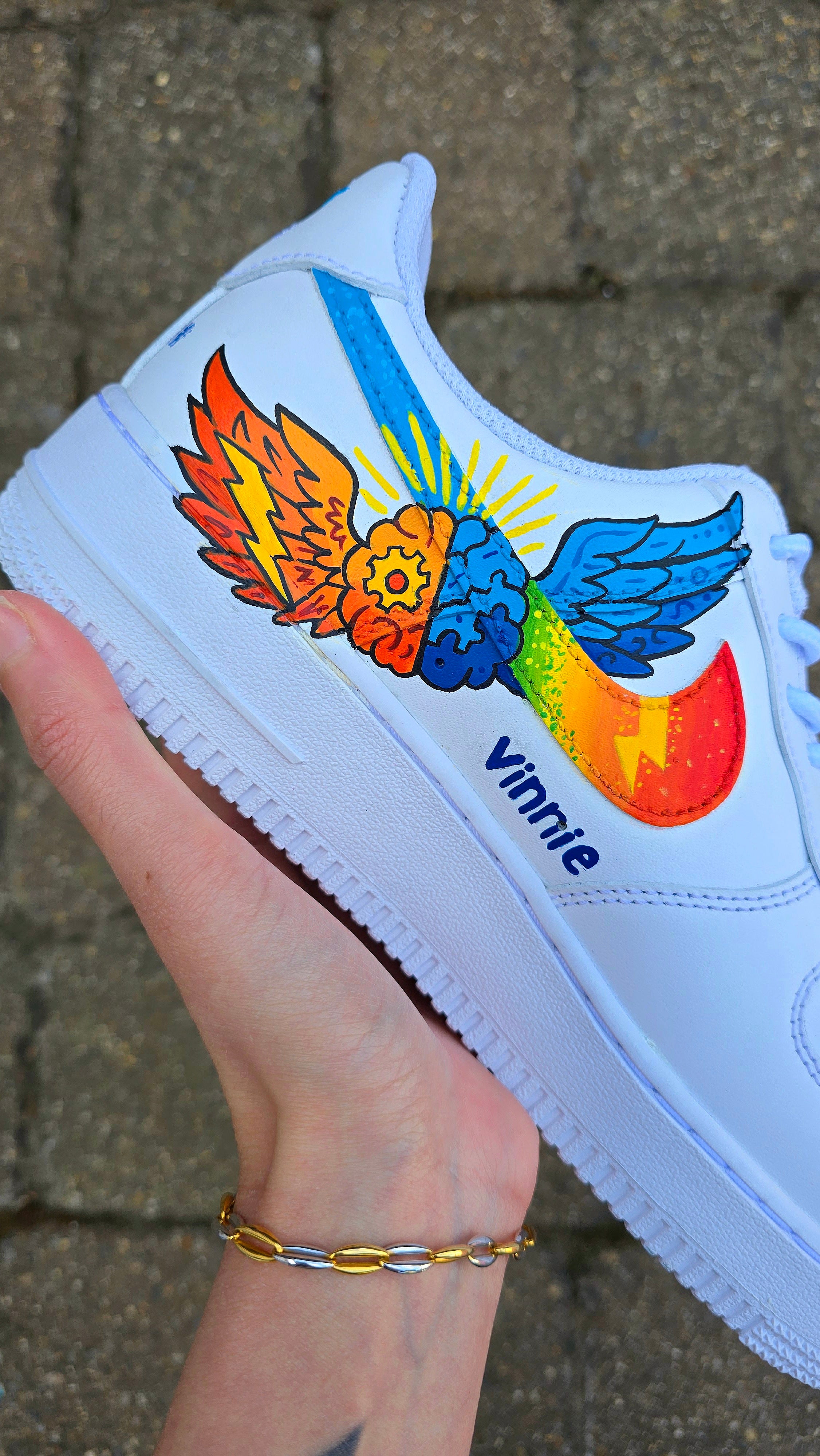 Custom hand-painted Nike Air Force 1 sneakers featuring a vibrant ADHD and Autism awareness design. Includes colourful puzzle pieces, infinity symbols, inspirational typography, and Chelsea FC Foundation branding. Crafted using waterproof and UV-protected leather paints for long-lasting wear. Each pair is unique, representing creativity, inclusivity, and neurodiversity. Perfect for collectors, awareness events, and personal expression.

