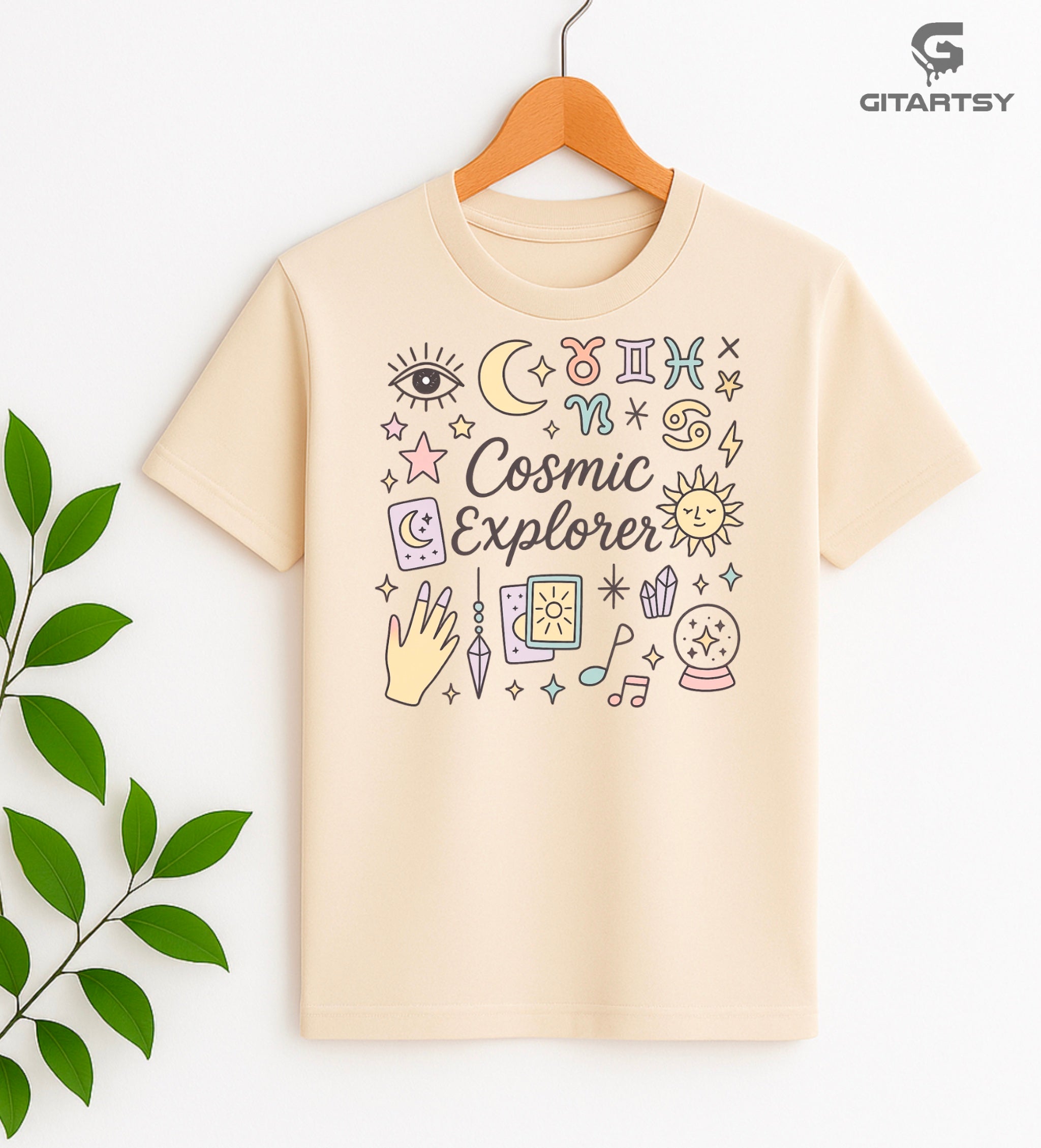 Pastel Cosmic Explorer T-shirt featuring zodiac signs, tarot cards, moon, sun, and celestial icons – perfect gift for astrologers, tarot readers, and spiritual mystics.