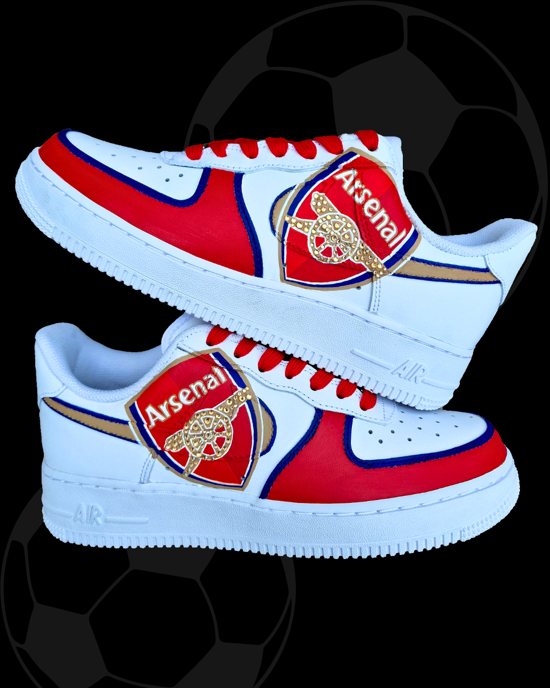 Custom Arsenal-themed Nike Air Force 1 sneakers featuring a bold red and white color scheme with royal blue accents. The shoes showcase a large 3D Arsenal FC crest on the outer panel of each shoe, highlighted with gold crystals embedded into the iconic cannon. A shimmering gold Nike swoosh with blue outline complements the hand-painted design. Red laces, team postcodes, and jersey numbers complete the sporty, fan-focused look. Perfect for football supporters or sneaker collectors. Authentically hand-painted