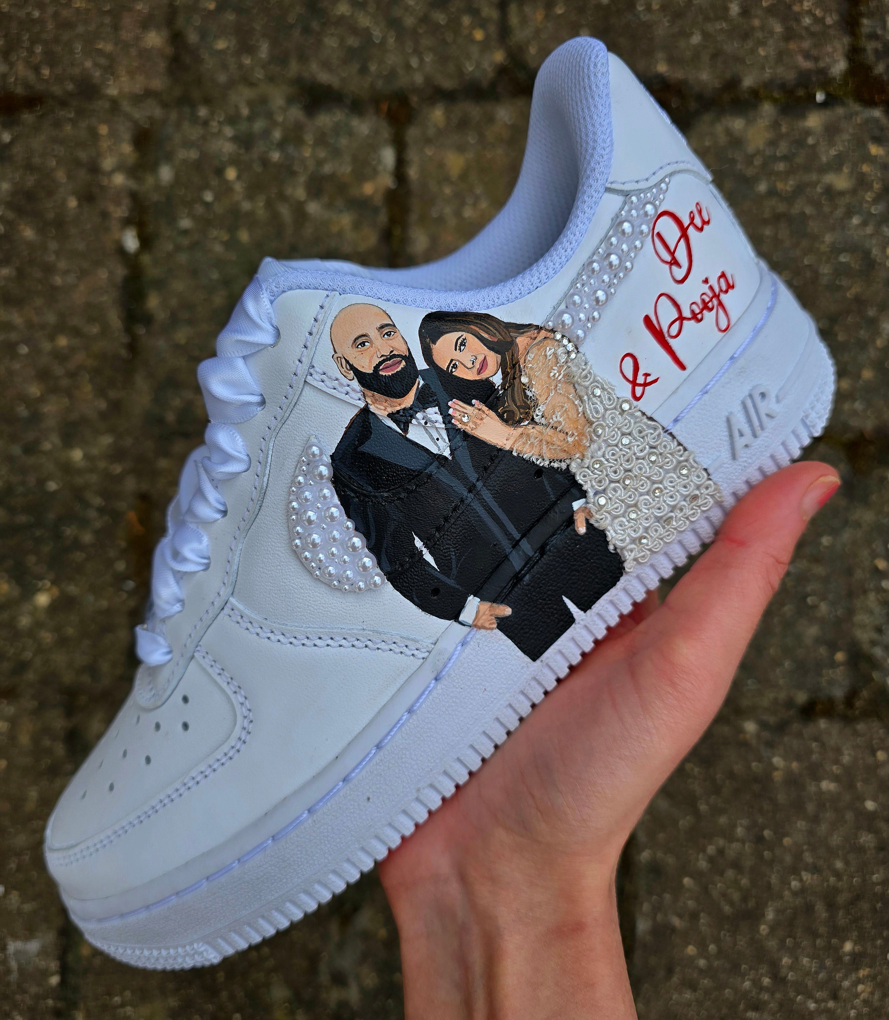 Custom Nike Air Force 1 sneakers hand-painted with a realistic bride and groom portrait, wedding attire details, and personalised touches such as names and dates. Embellished with pearls, rhinestones, and gold accents, these sneakers feature intricate artwork depicting the couple in formal wear and symbolic wedding imagery like clasped hands. Crafted with professional-grade leather paints and sealed for long-lasting wear, these wedding edition shoes combine comfort, style, and sentimental value.

