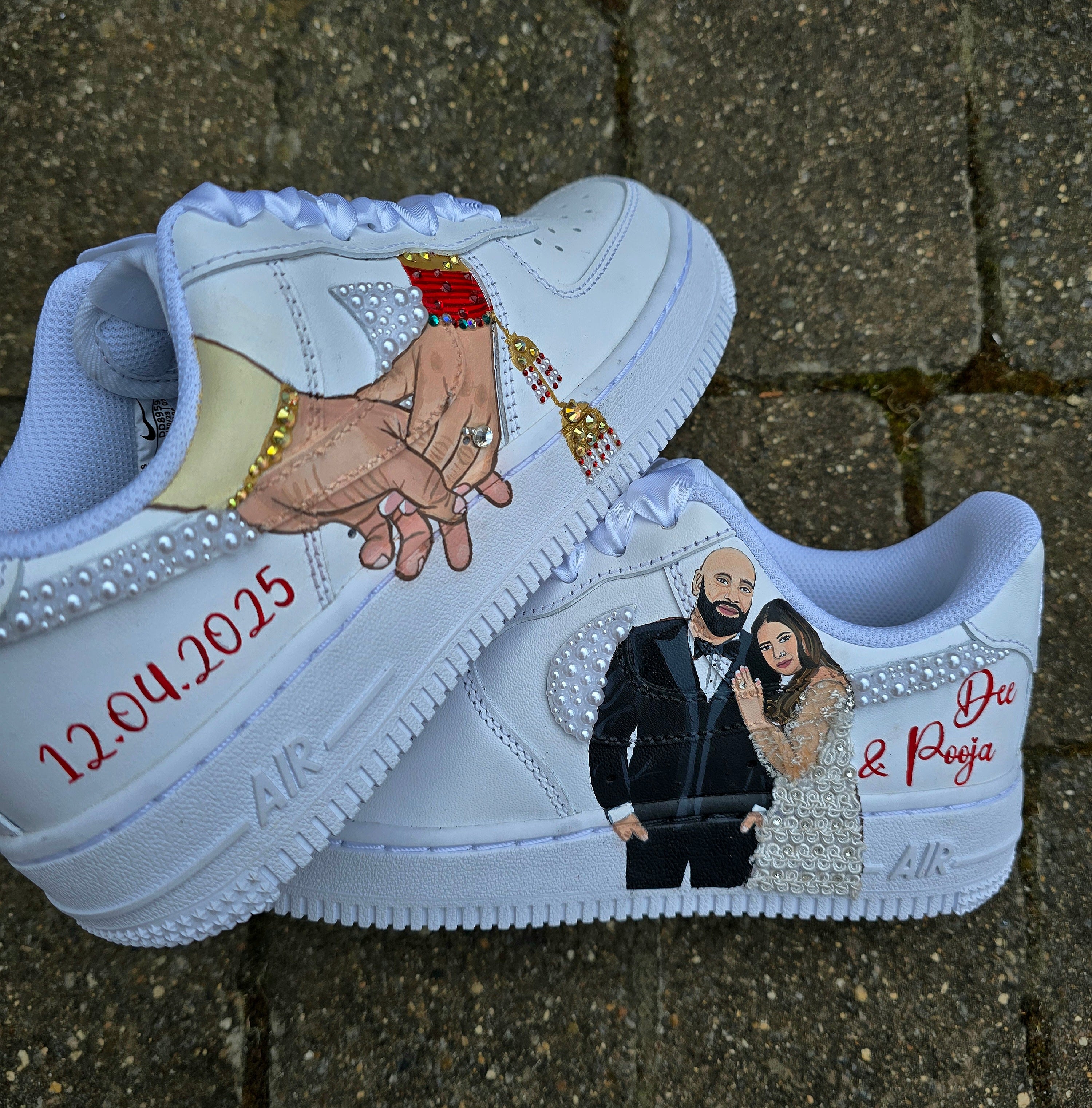 Custom Nike Air Force 1 sneakers hand-painted with a realistic bride and groom portrait, wedding attire details, and personalised touches such as names and dates. Embellished with pearls, rhinestones, and gold accents, these sneakers feature intricate artwork depicting the couple in formal wear and symbolic wedding imagery like clasped hands. Crafted with professional-grade leather paints and sealed for long-lasting wear, these wedding edition shoes combine comfort, style, and sentimental value.

