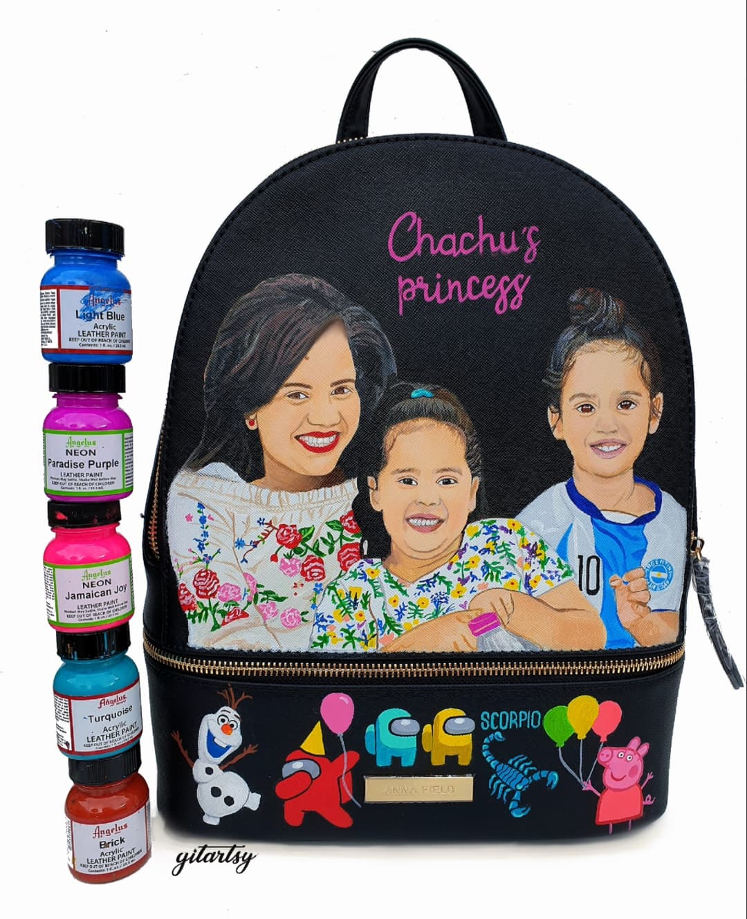 Custom family portrait hand-painted backpack showing a smiling mother and two daughters on the front panel, with colorful characters and zodiac motifs at the bottom; crafted with premium leather paints, showcasing personalized details like names, favorite cartoons, and astrological signs.

