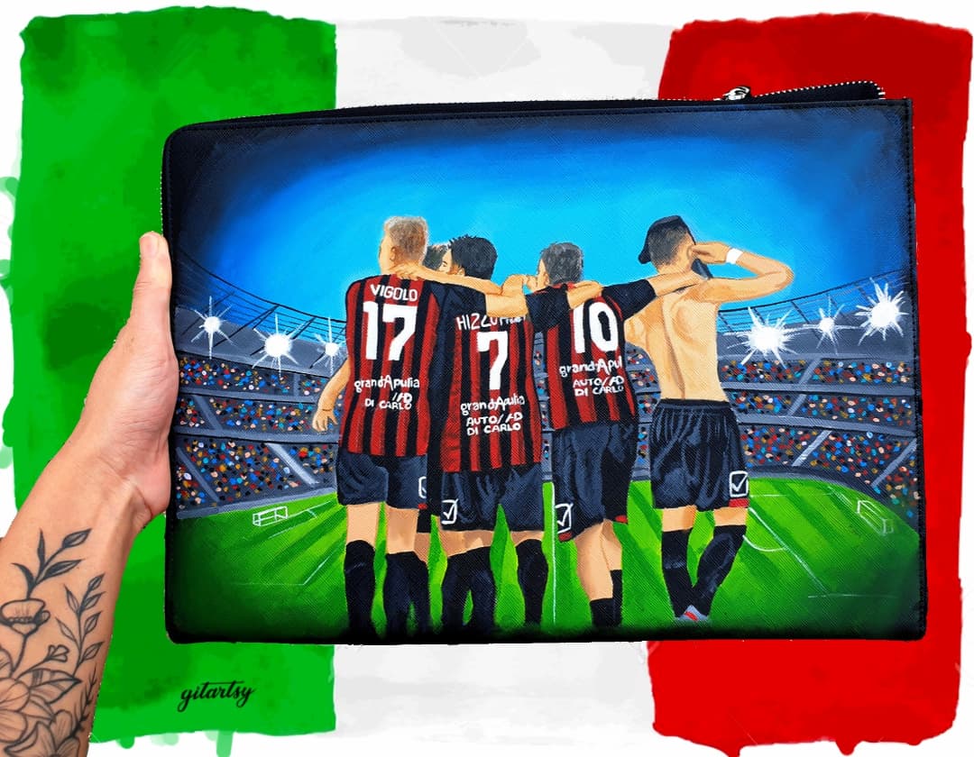 Custom hand-painted footballer artwork wallet depicting four players in red and black striped jerseys with names and numbers, standing arm-in-arm on a stadium field under bright lights, perfect for football fans and players, crafted on a black canvas zippered pouch with vivid colors and intricate details.

