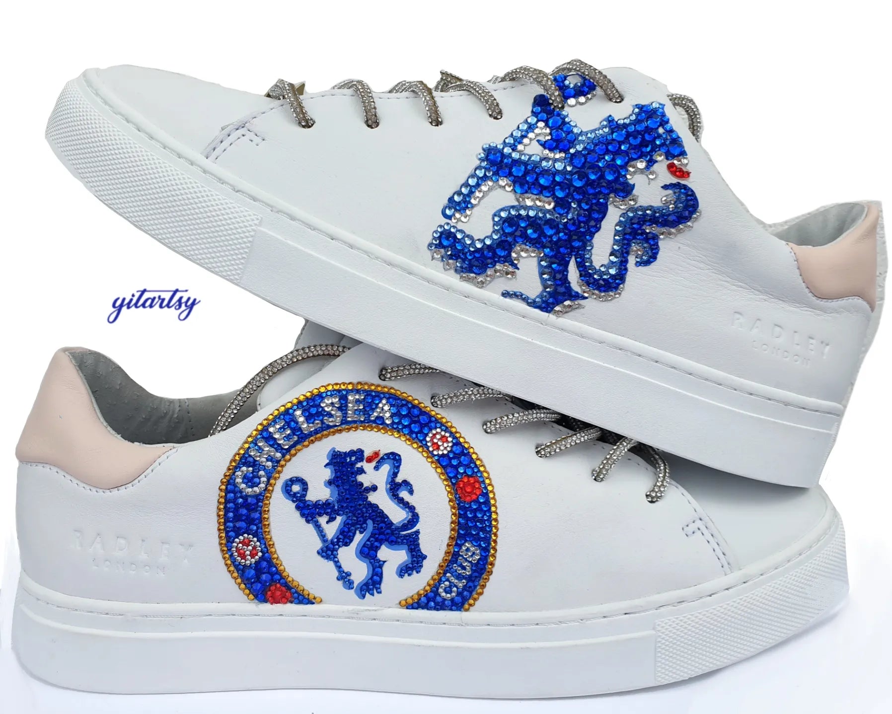 Chelsea FC CFC logo hand painted on white Radley London sneakers, topped with crystals and rhinestones and rhinestone shoelaces - both shoes on white background