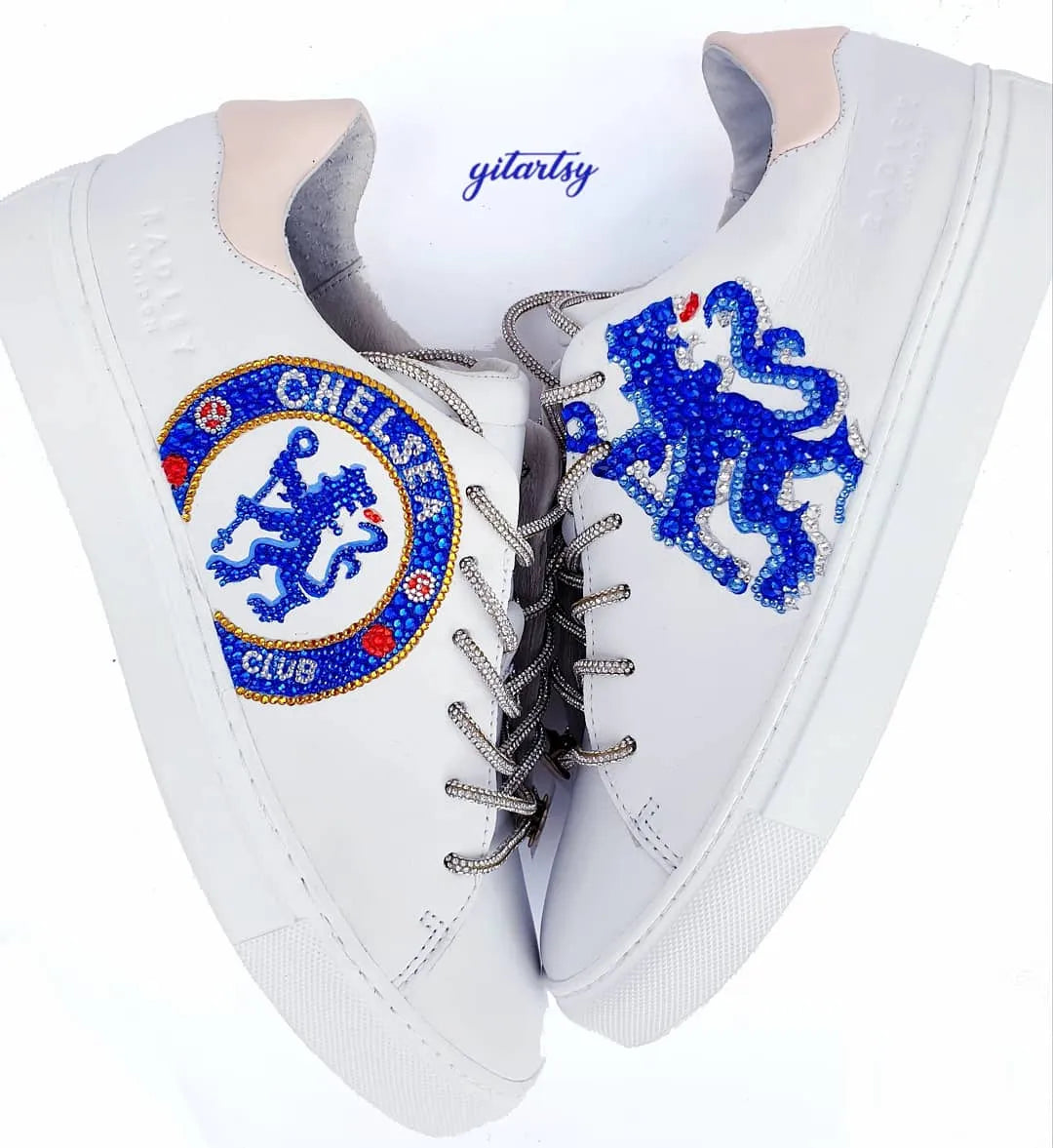 Chelsea FC CFC logo hand painted on white Radley London sneakers, topped with crystals and rhinestones and rhinestone shoelaces - both shoes on white background