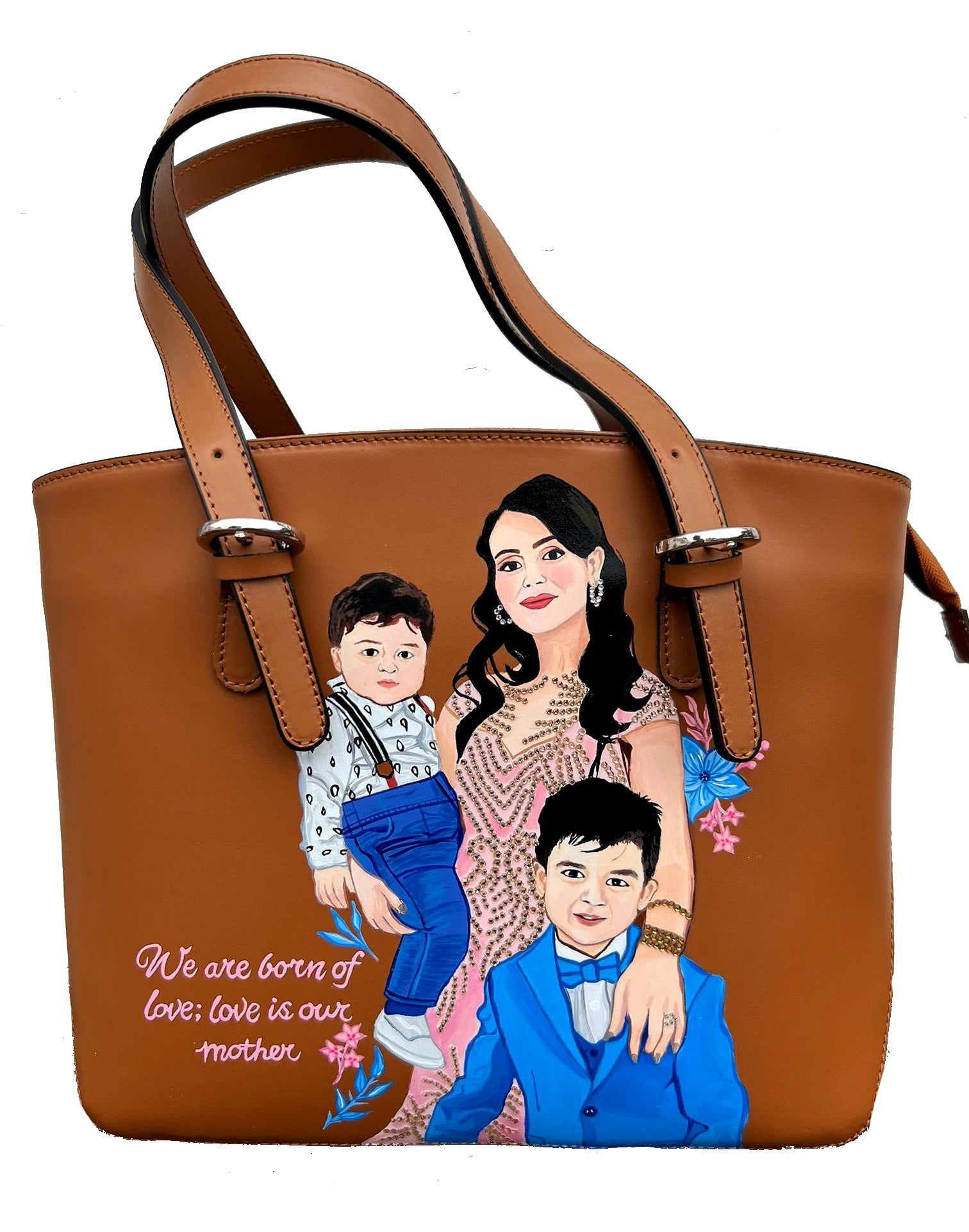 A custom hand-painted tan leather tote bag featuring a family portrait of a mother and two children, designed in a detailed artistic style with floral embellishments and a heartfelt quote. This unique leather bag is personalized from your photos and painted using durable, waterproof paints, ideal as a memory keepsake or meaningful gift for mothers. The painted design stands out against the rich tan leather, making it both functional and sentimental.

