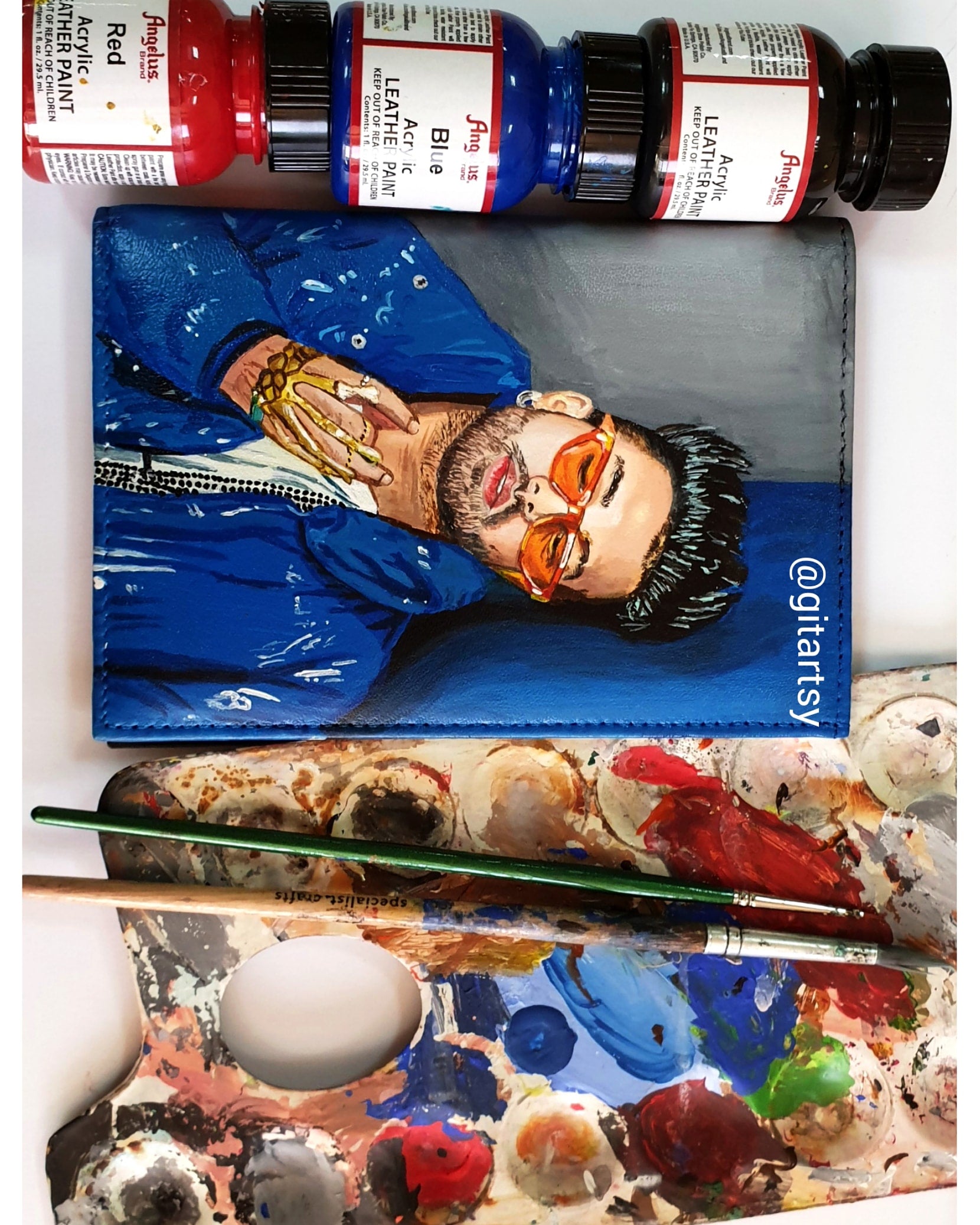 A hand-painted leather wallet featuring a custom portrait of a person, pet, or loved one. The painting is detailed, colourful, and made using premium-quality waterproof leather paints. Ideal for gifting or personal keepsakes, this wallet showcases artistic craftsmanship and premium leatherwork.

