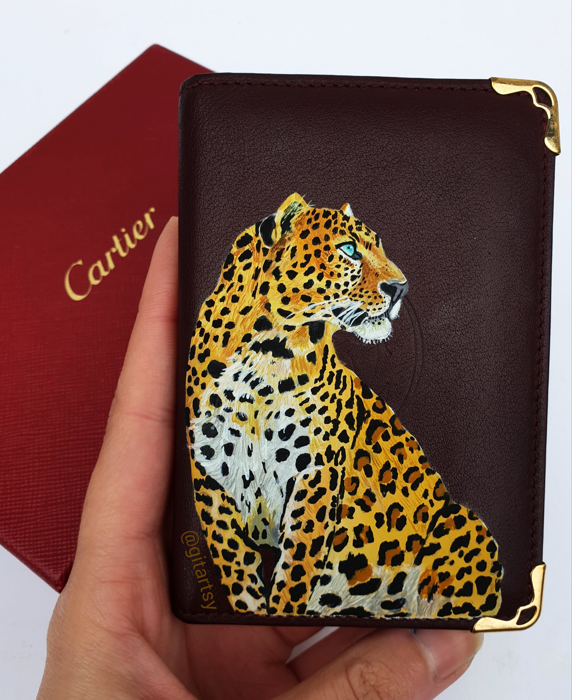 A hand-painted leather wallet featuring a custom portrait of a person, pet, or loved one. The painting is detailed, colourful, and made using premium-quality waterproof leather paints. Ideal for gifting or personal keepsakes, this wallet showcases artistic craftsmanship and premium leatherwork.

