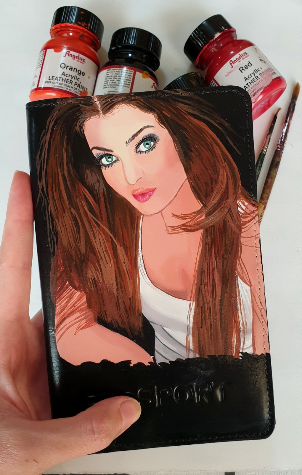 A hand-painted leather wallet featuring a custom portrait of a person, pet, or loved one. The painting is detailed, colourful, and made using premium-quality waterproof leather paints. Ideal for gifting or personal keepsakes, this wallet showcases artistic craftsmanship and premium leatherwork.

